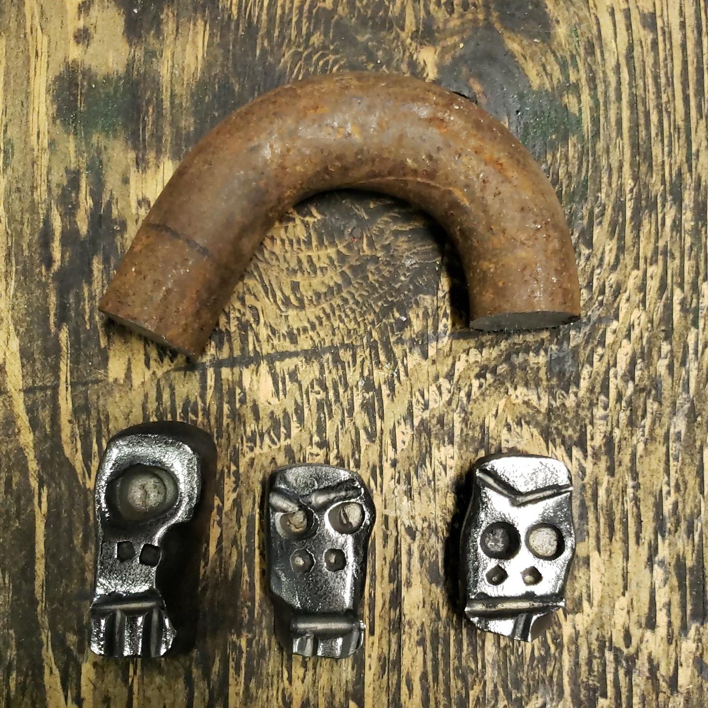 A couple wrought iron Skullies from 100+ year old anchor chain