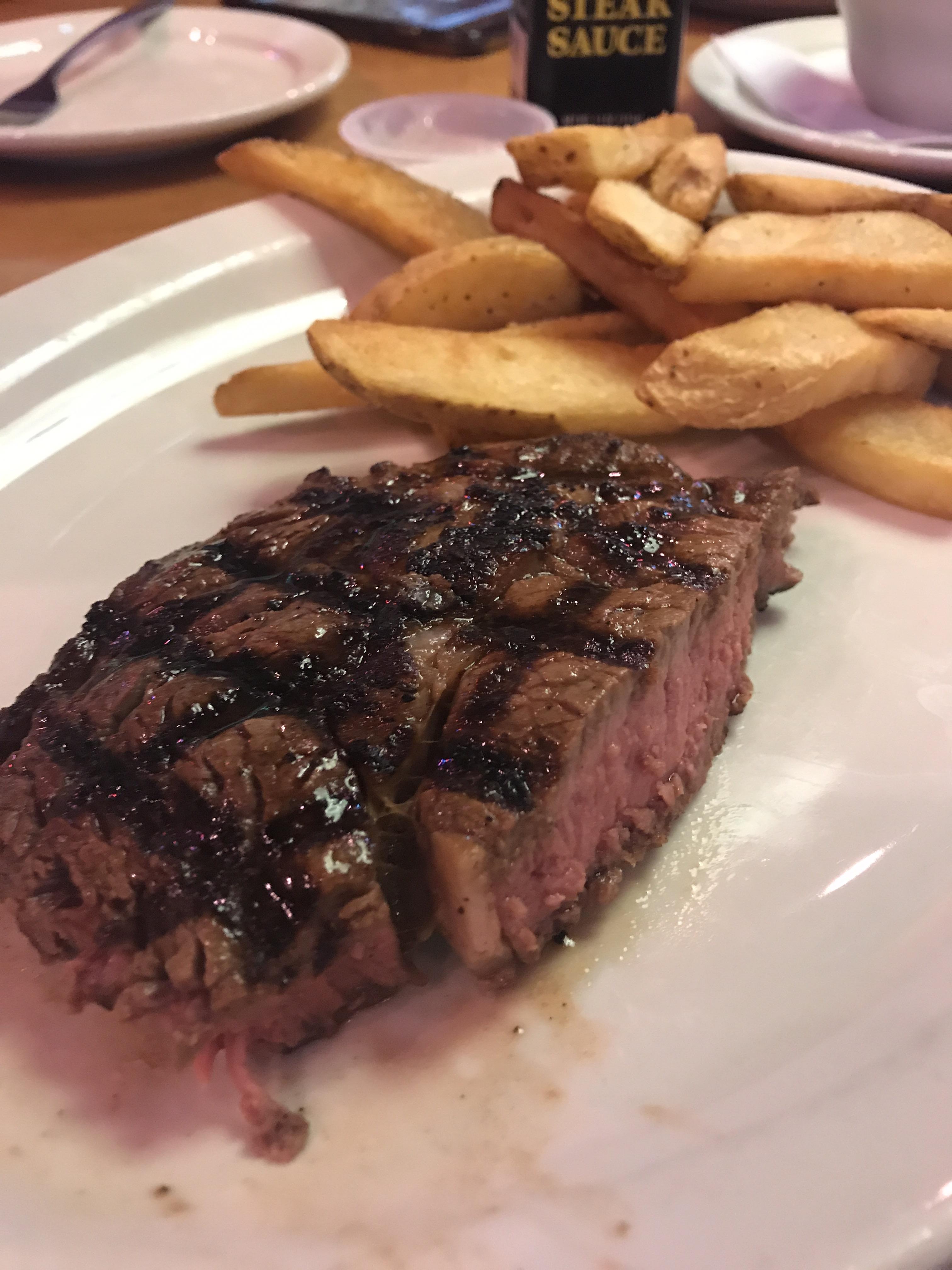 Delicious RibEye cooked medium and steak fries from Texas Roadhouse