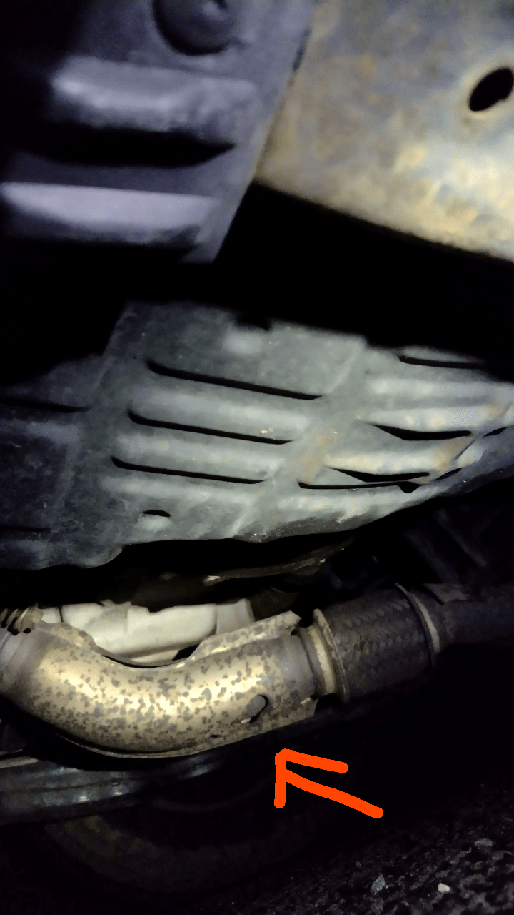 Is this a hole in exhaust pipe or shield? r/MechanicAdvice