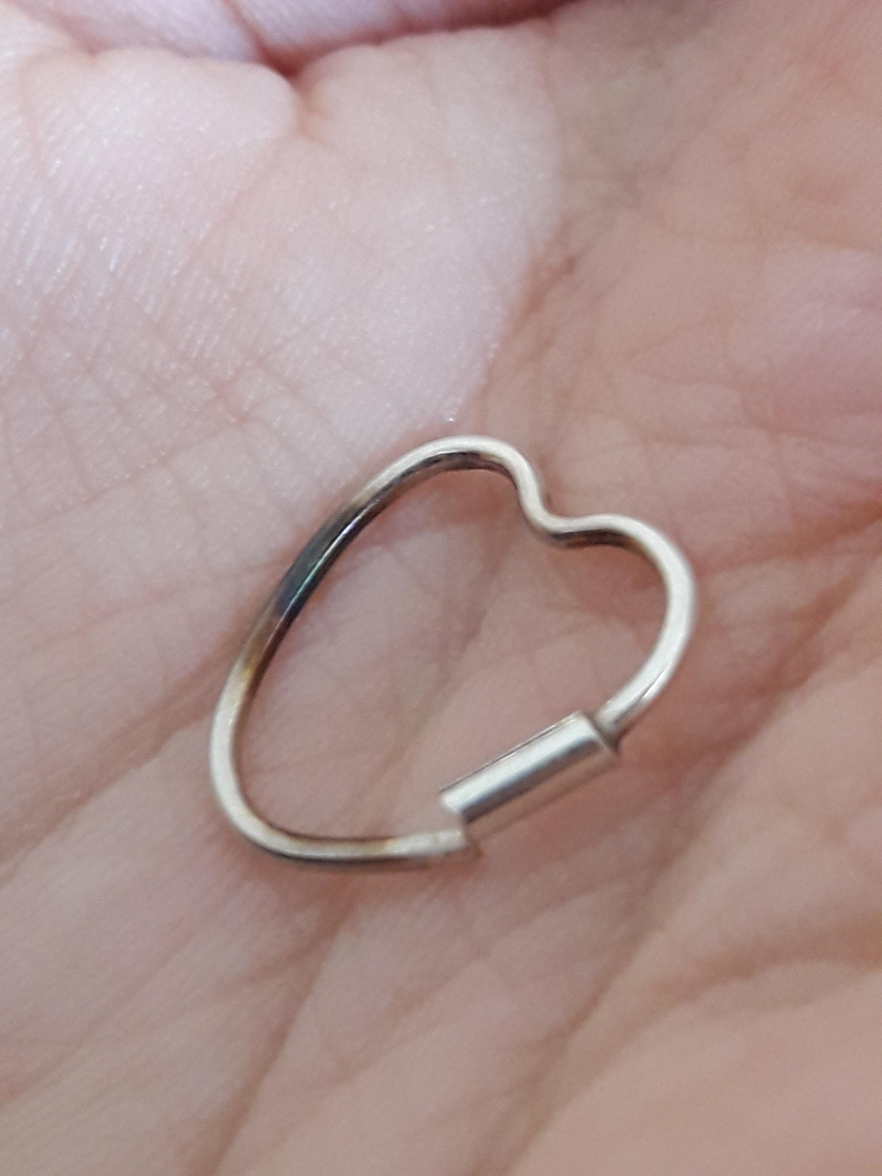 My earring looks burned on the side it was touching my skin. Any idea