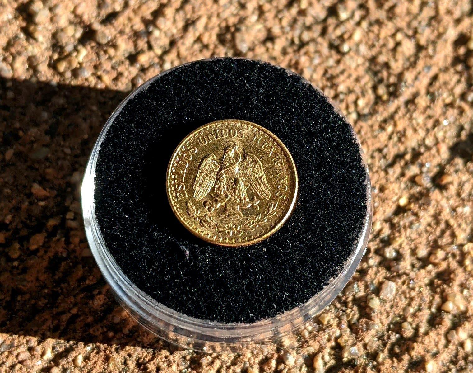 I won this gold two pesos coin in a metal detecting contest at my local
