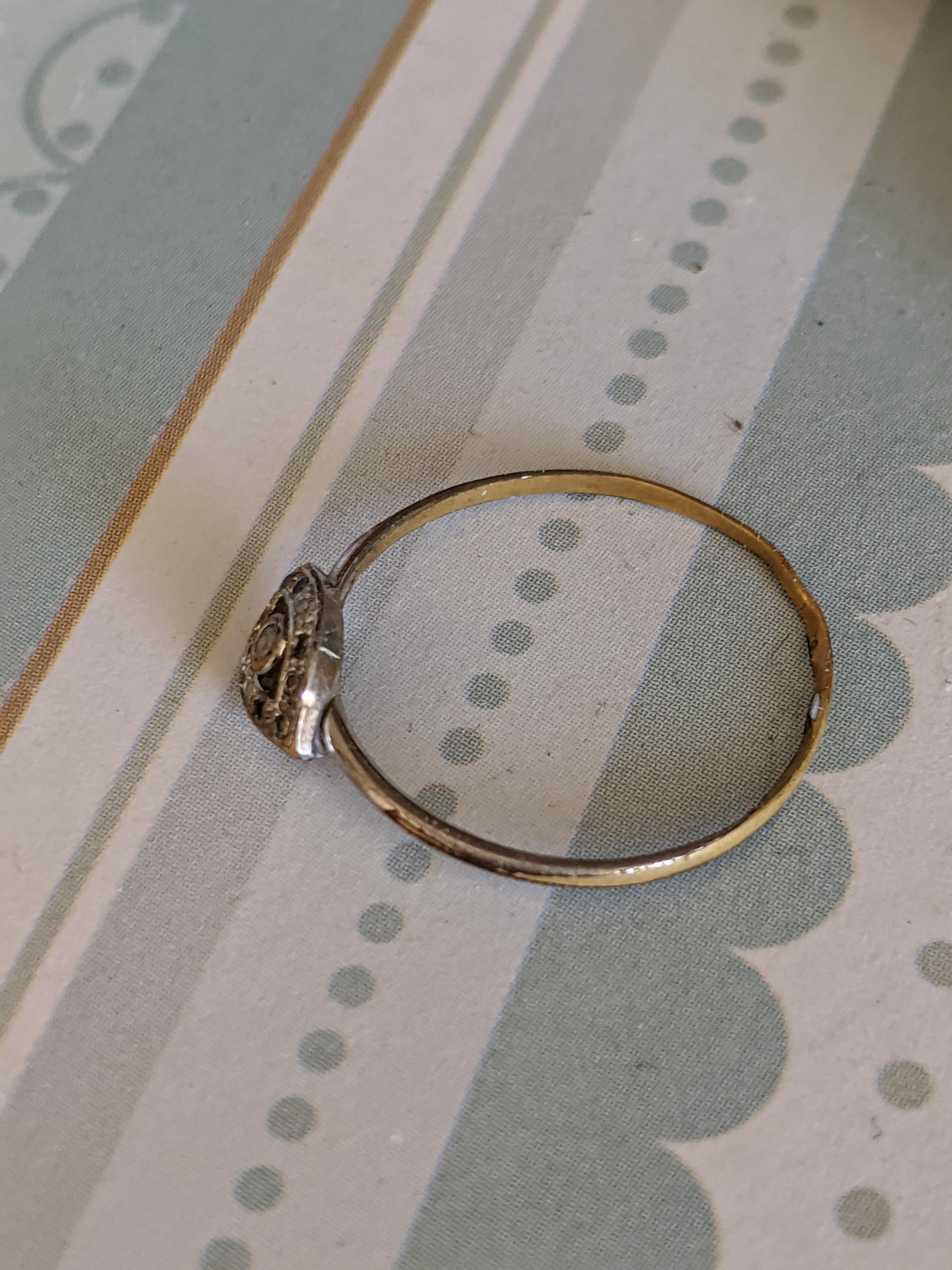 Jeweler said she can't fix it. Said she can't tell the metal. Help. r