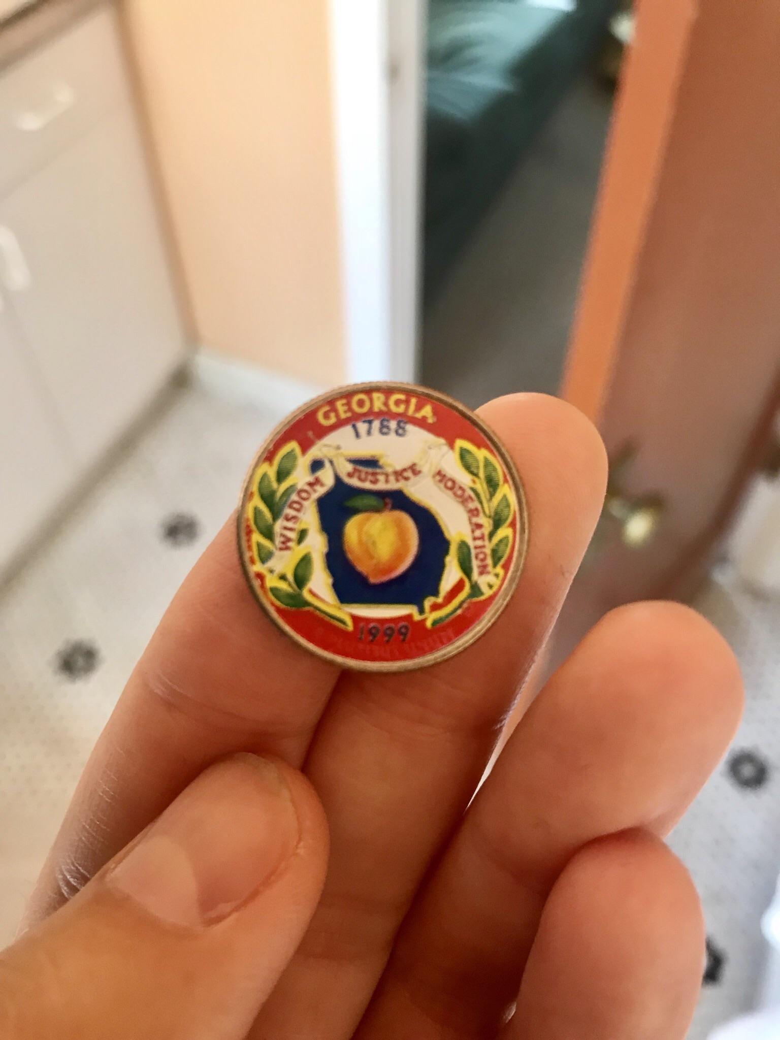 I found this painted quarter in a roll of quarters that I got