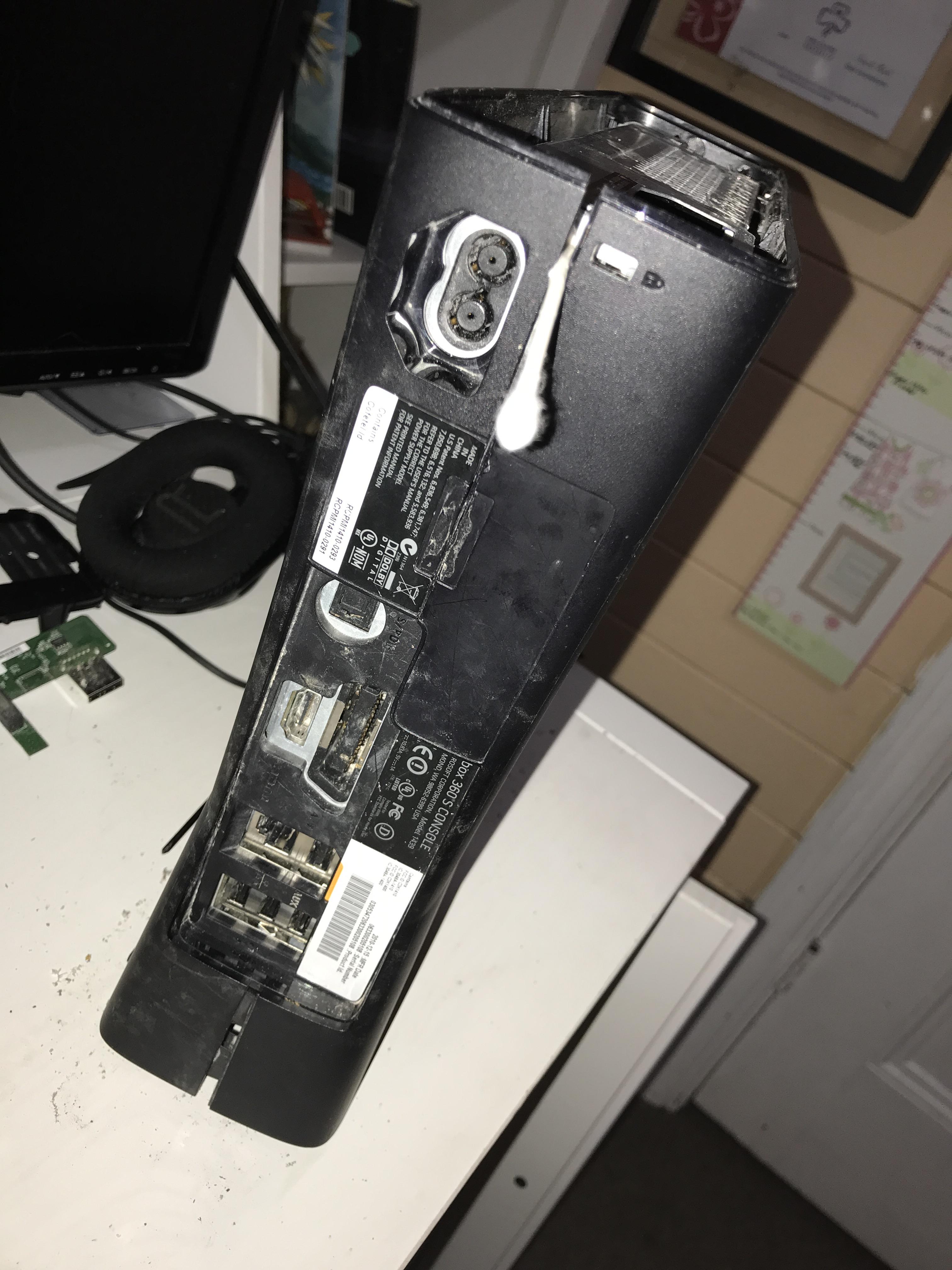 Currently trying to open up a broken Xbox 360 slim. How do I open up