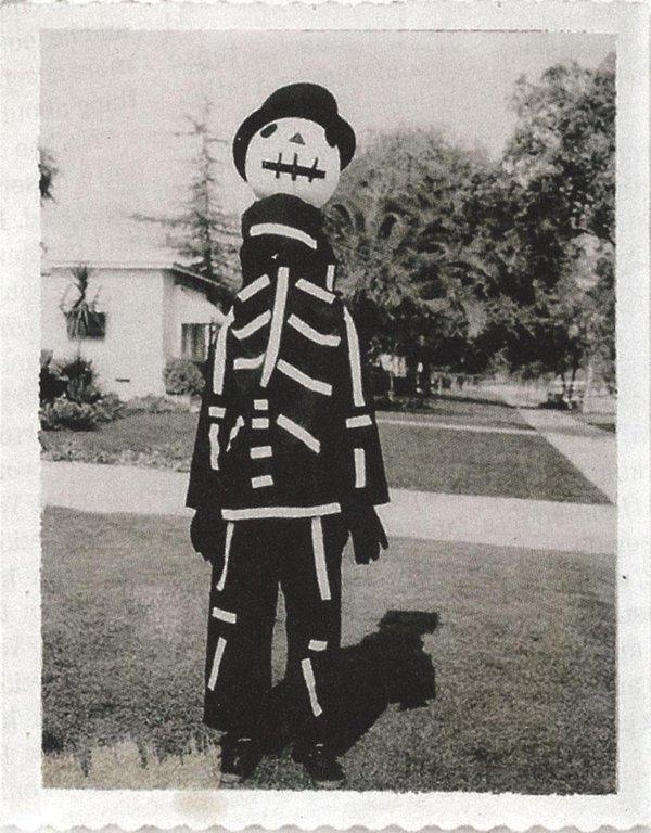 Tim Burton showing off a Halloween costume made by his mother, 1967 pics