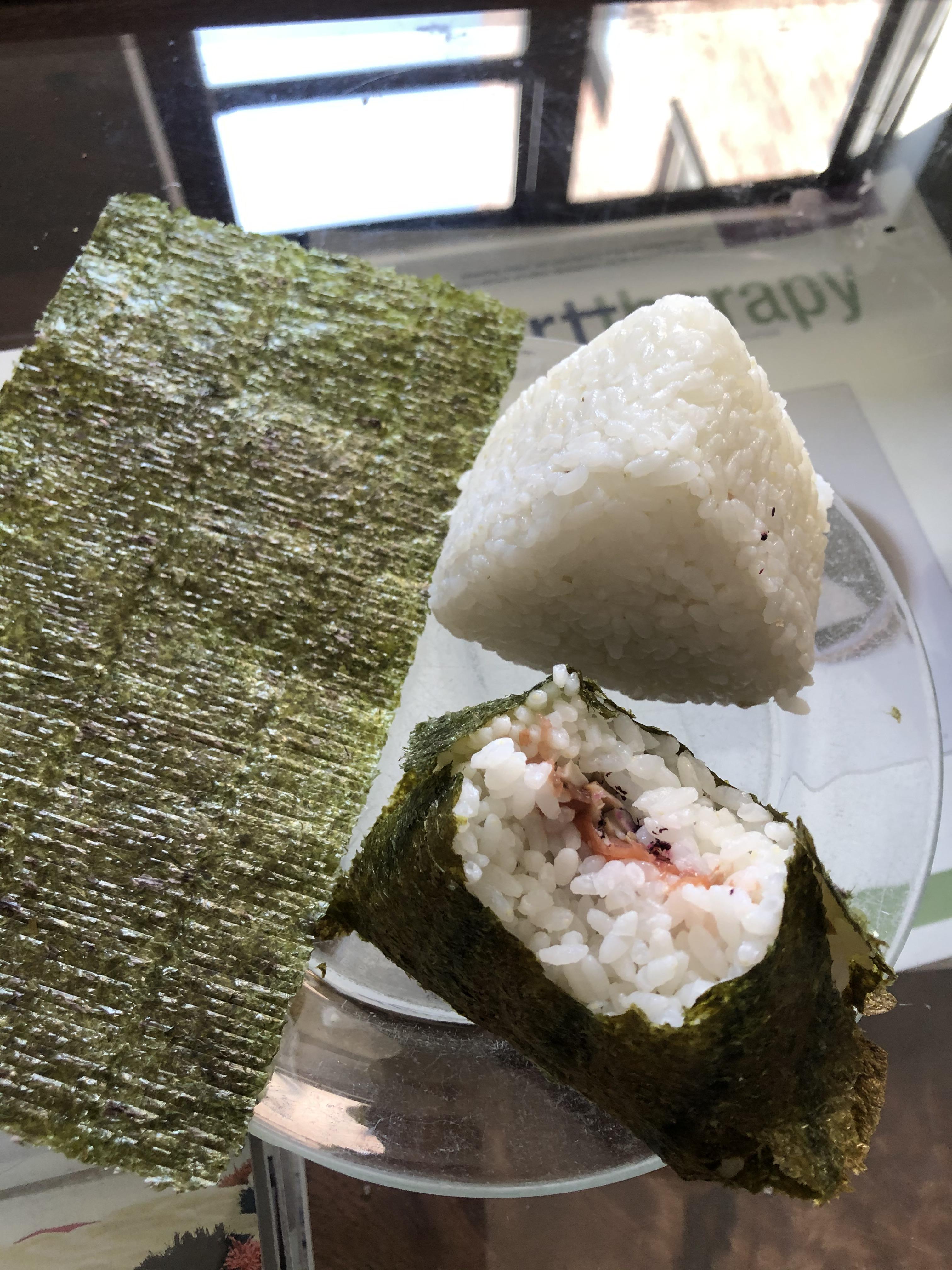 Ume boshi, shiitaki, shiso (furikake) onigiri. Protip of your nori is stale, pop it in the