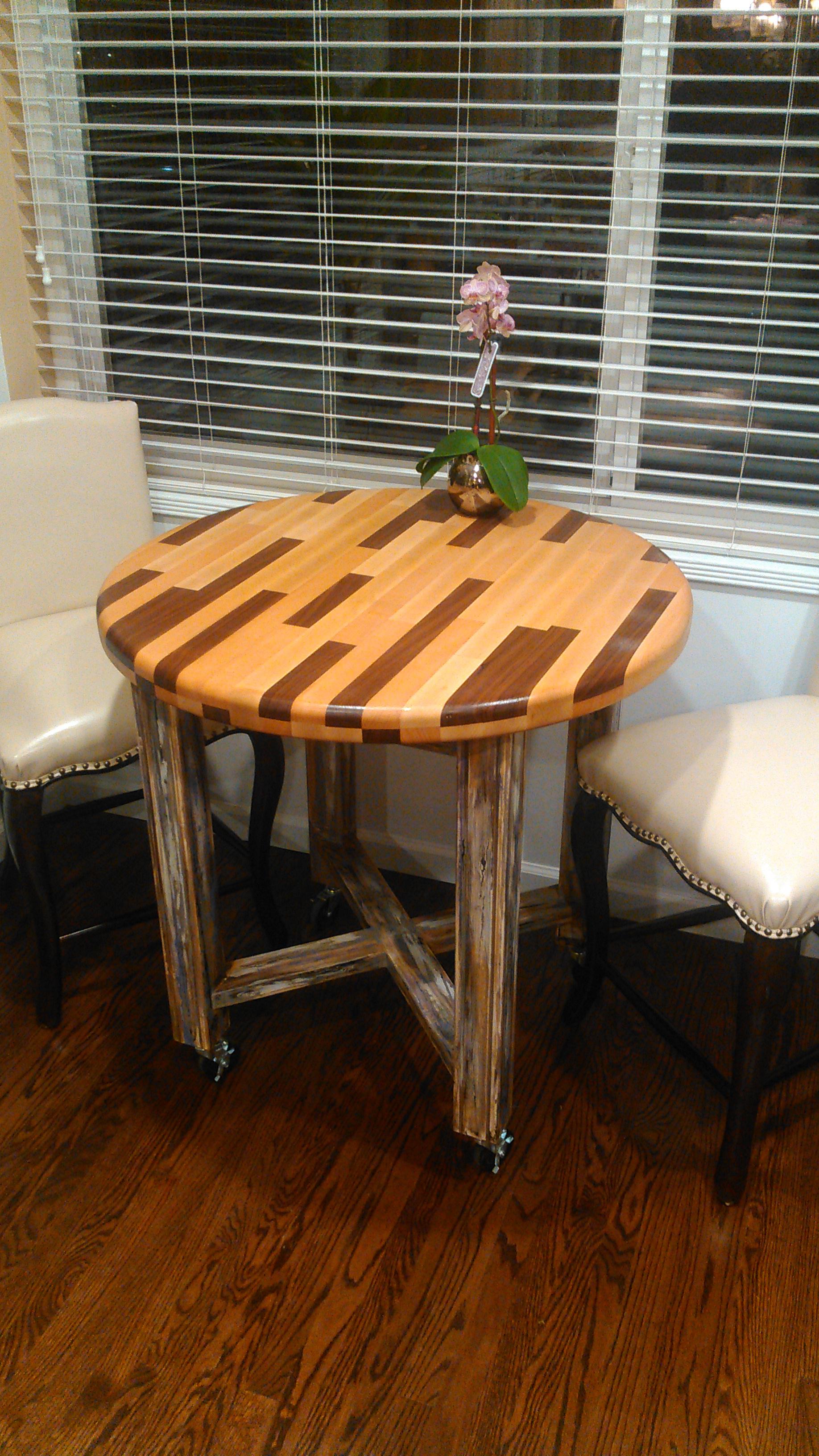 Small rolling kitchen table/rolling island cutting board. It's walnut, beech, hard maple