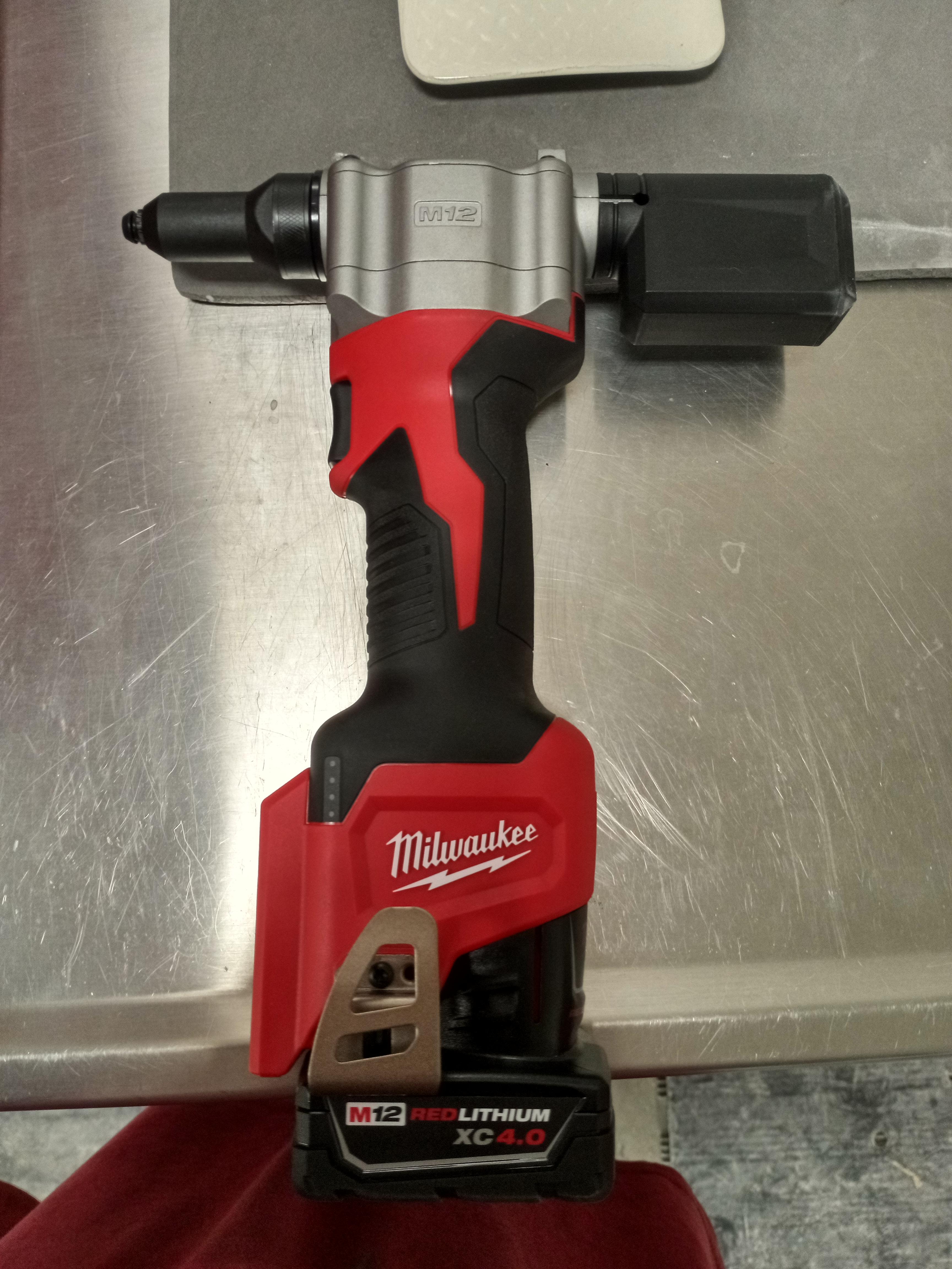 Milwaukee, battery powered rivet gun. I use it to put fender flares on