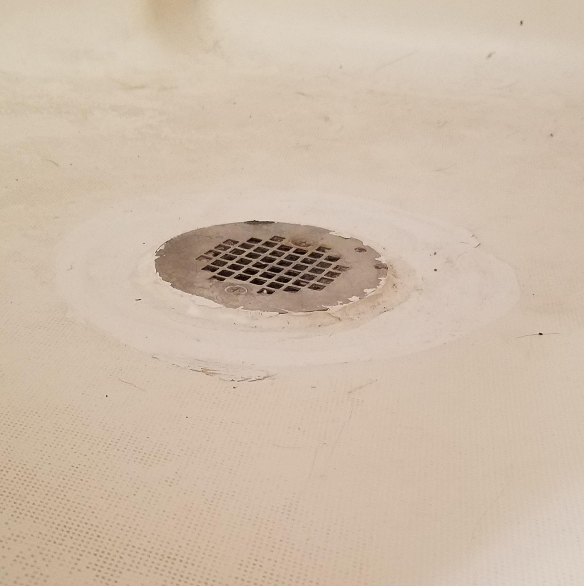 Shower drain 1/4" higher than floor. How to fix? r/Plumbing