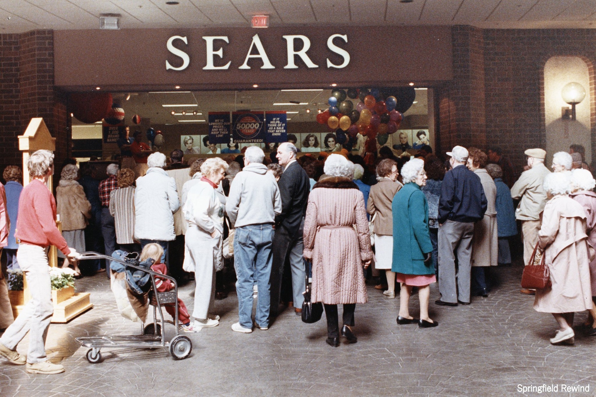 Customers waiting for Sears to open for a sale at White Oaks Mall in