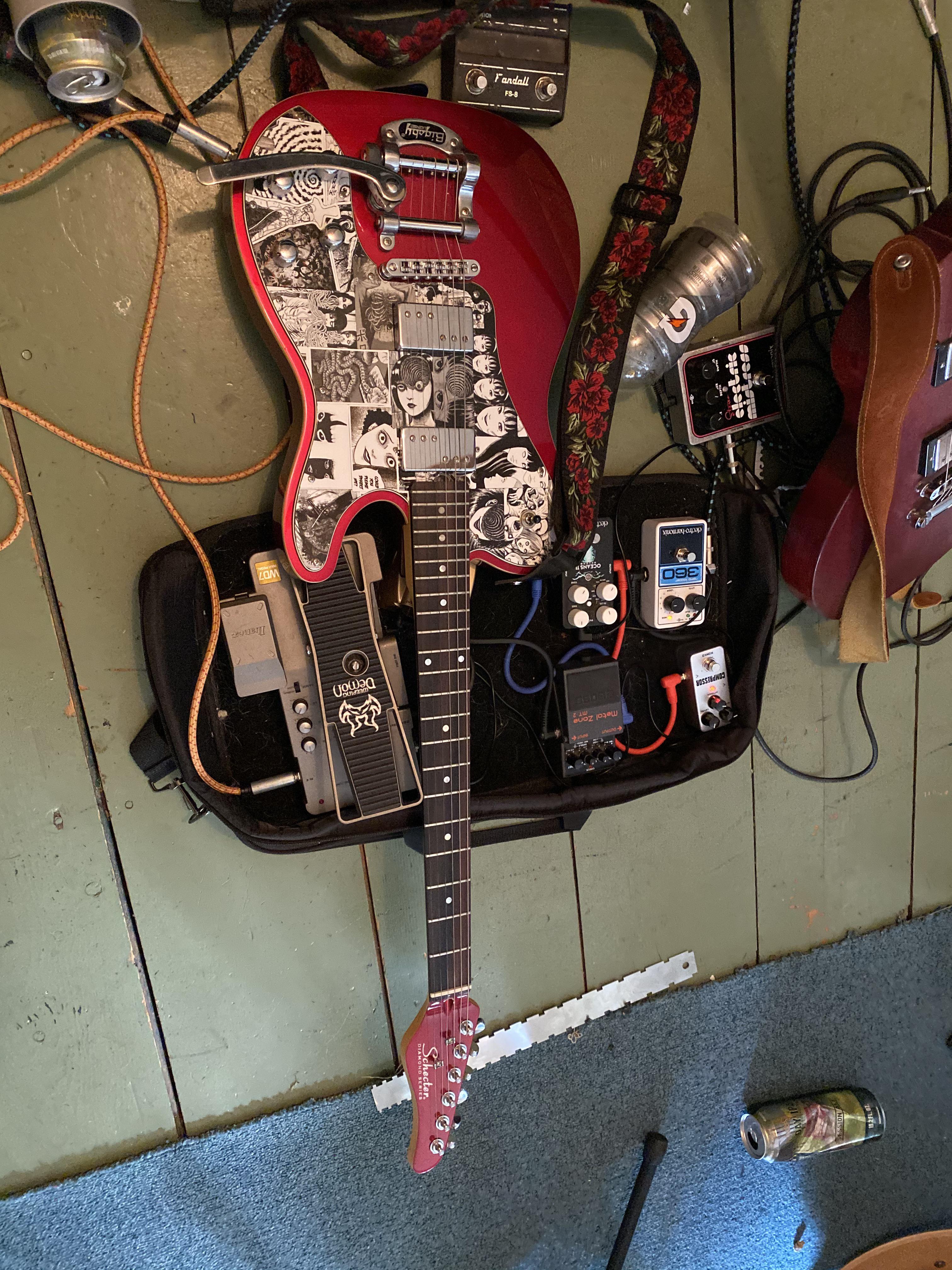 Finished sticker bombing my guitar that I posted on here a few months