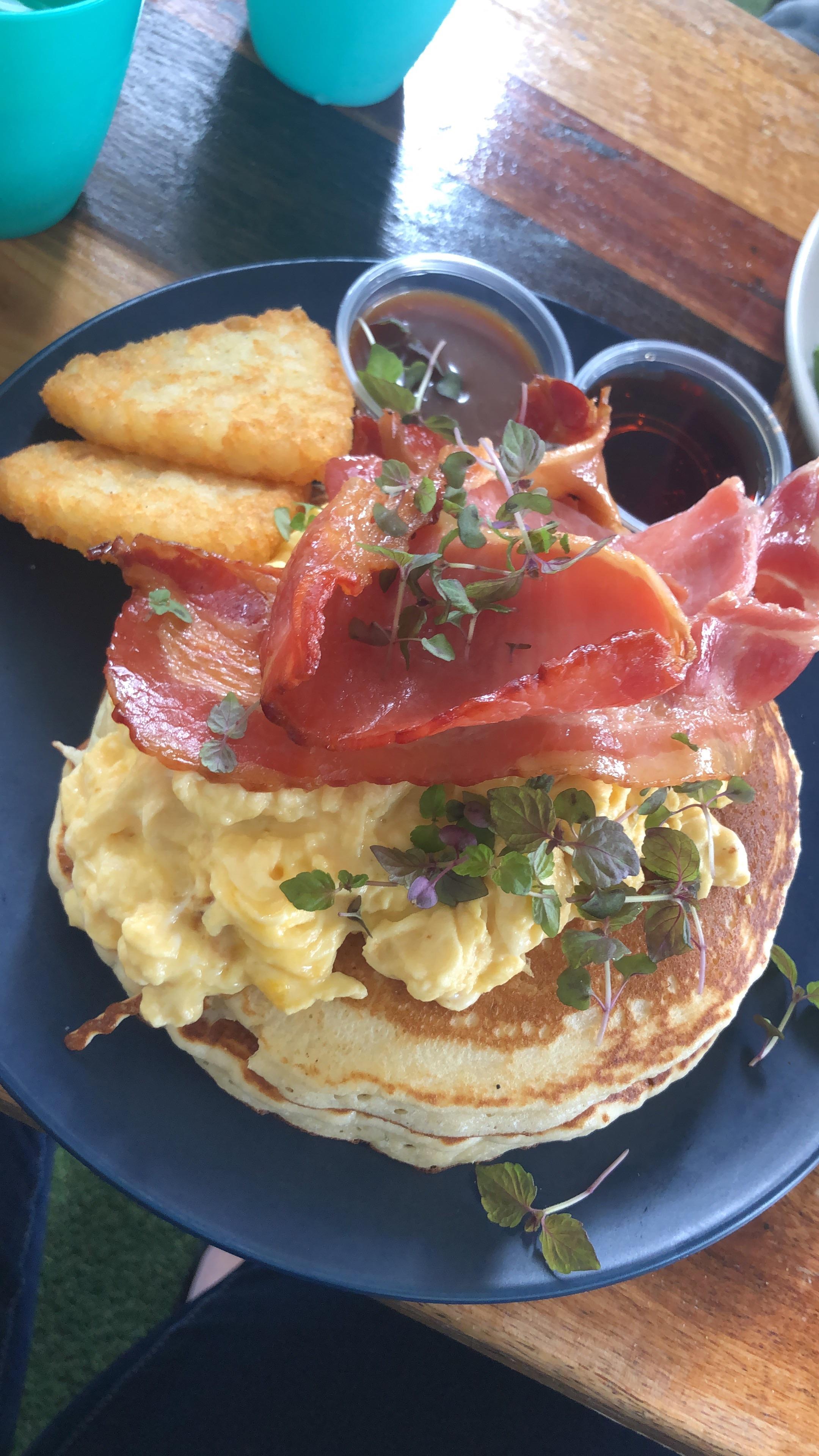 [i ate] pancakes with scrambled eggs, bacon, hash browns, maple syrup