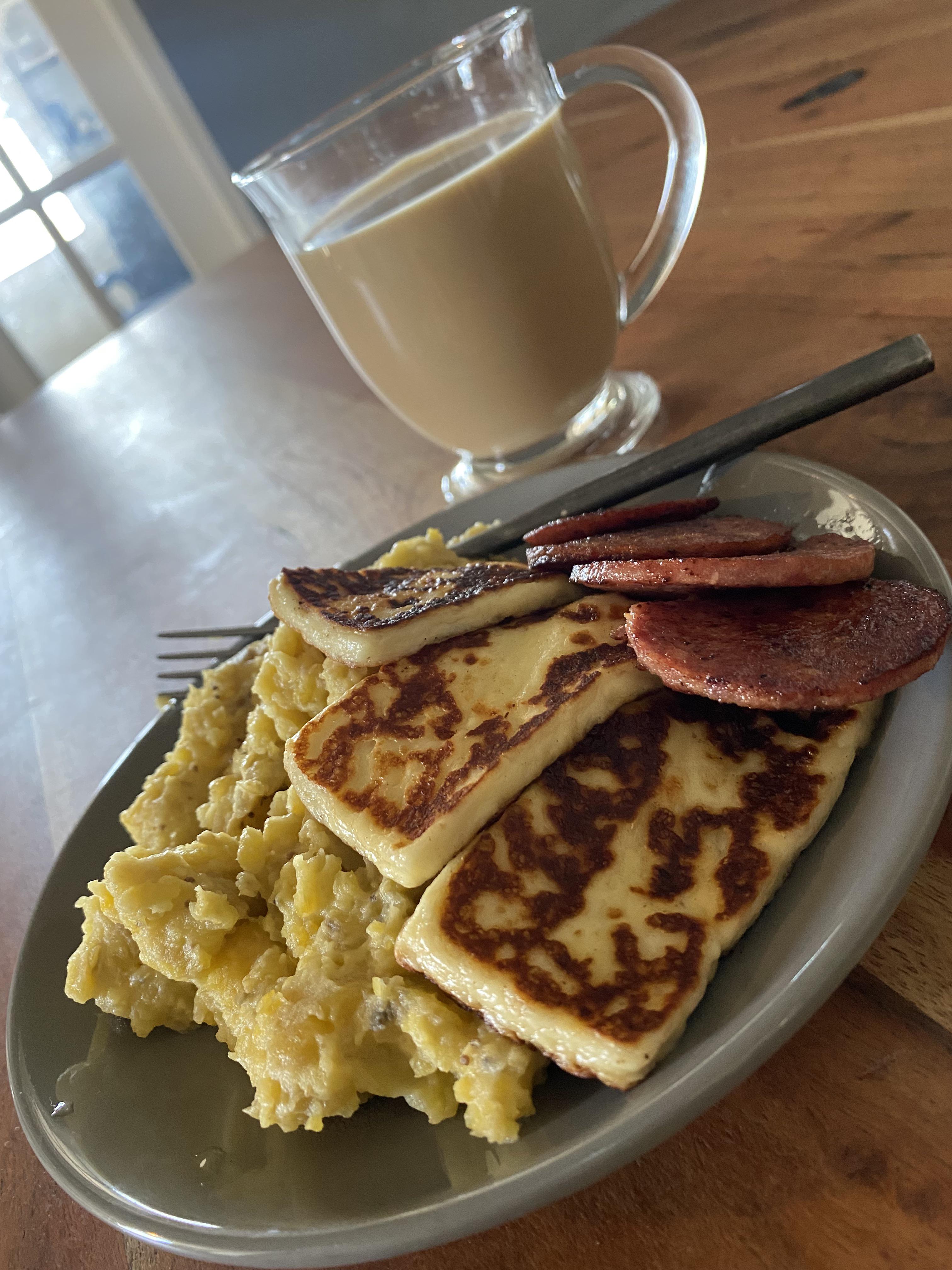 Fried Dominican style salami, fried cheese, and alongside mangú. She