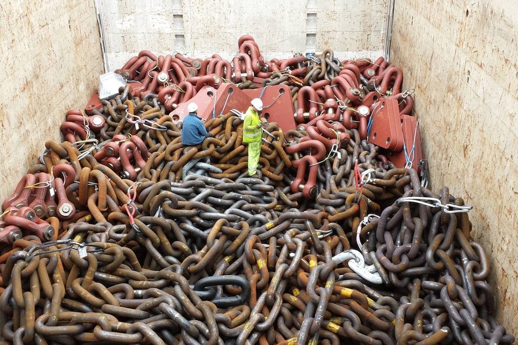 An anchor chain, with a human to scale. interestingasfuck