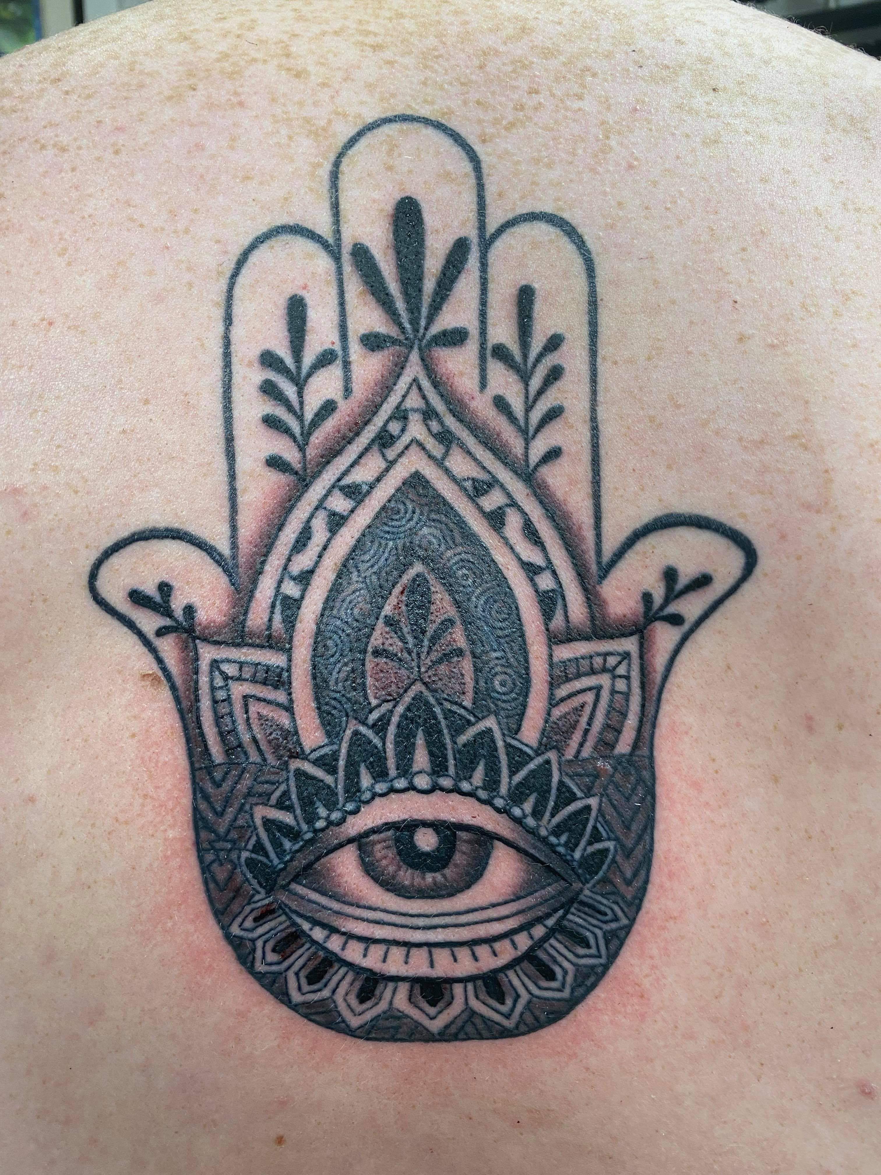 My hamsa hand back tattoo. The first time I broke through, at the end