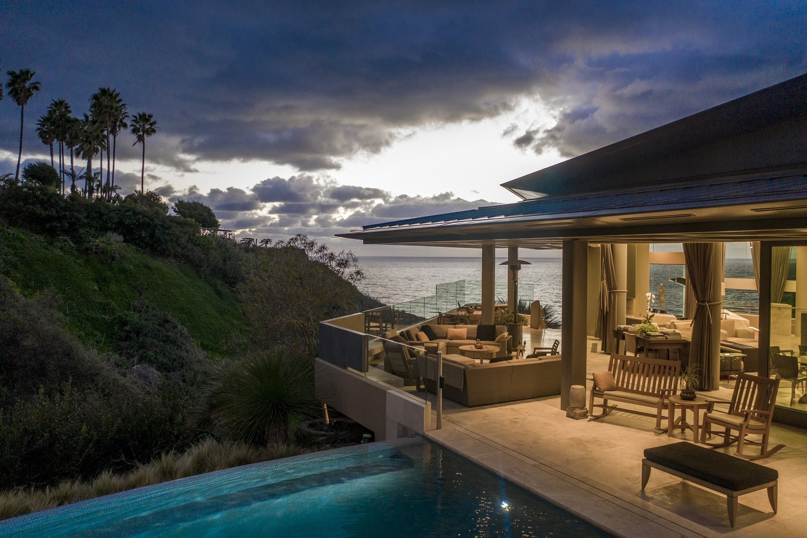 Beach front living room spills through open walls onto Porch. 18