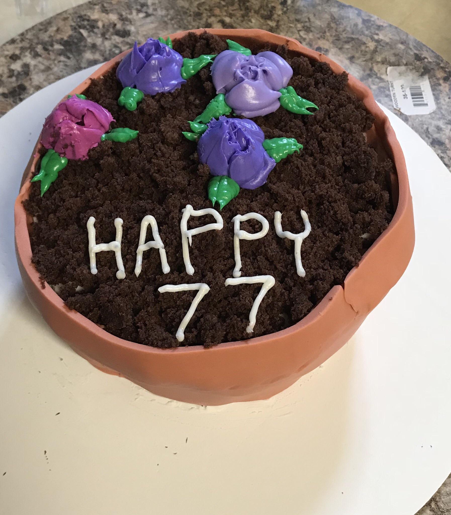 Flower pot cake I made for a birthday. First time trying russian piping