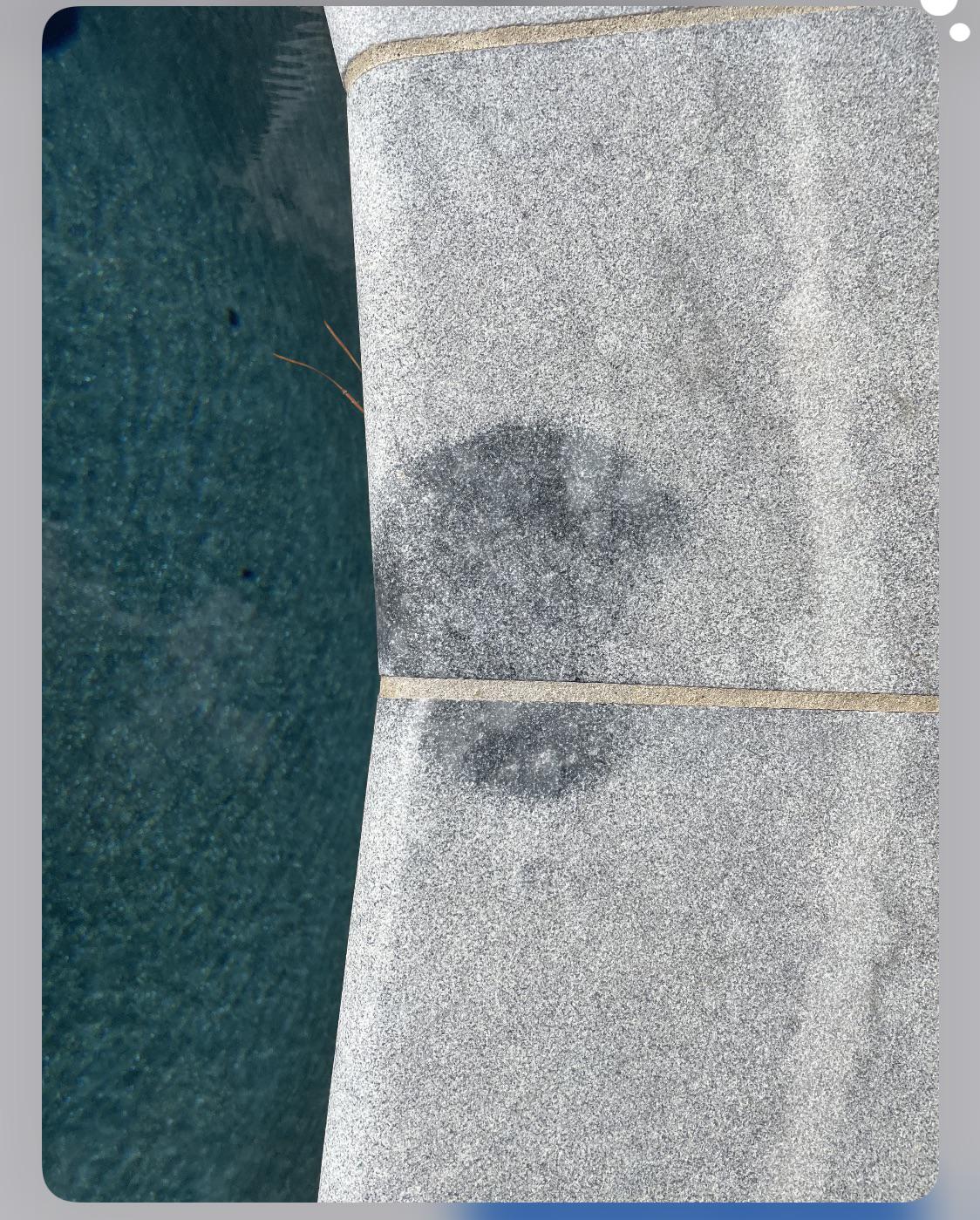 Stain. I believe a leaking muriatic acid bottle sat on top of some salt