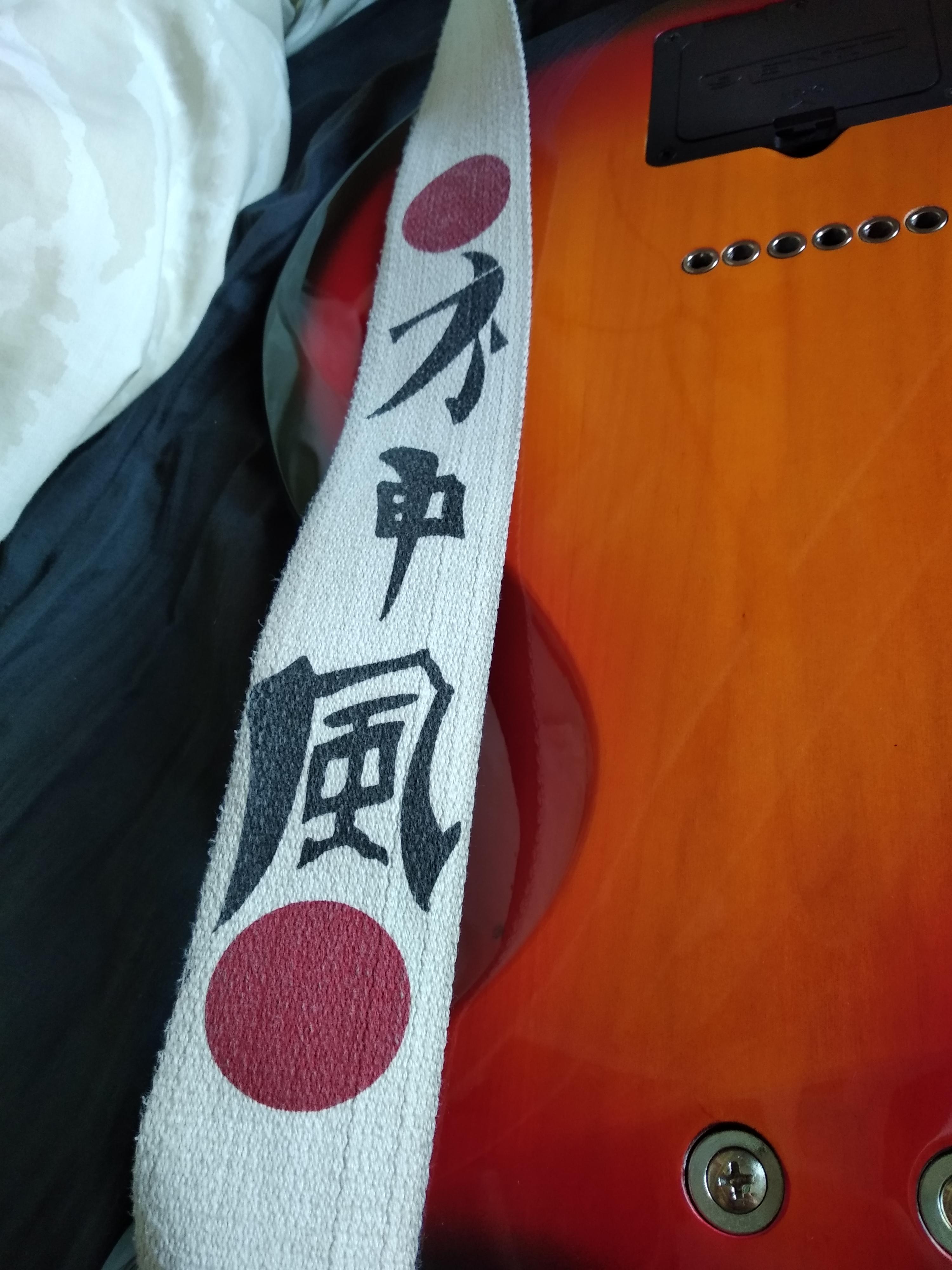 [Japanese > English] Guitar Strap Text, Google translate isnt helping