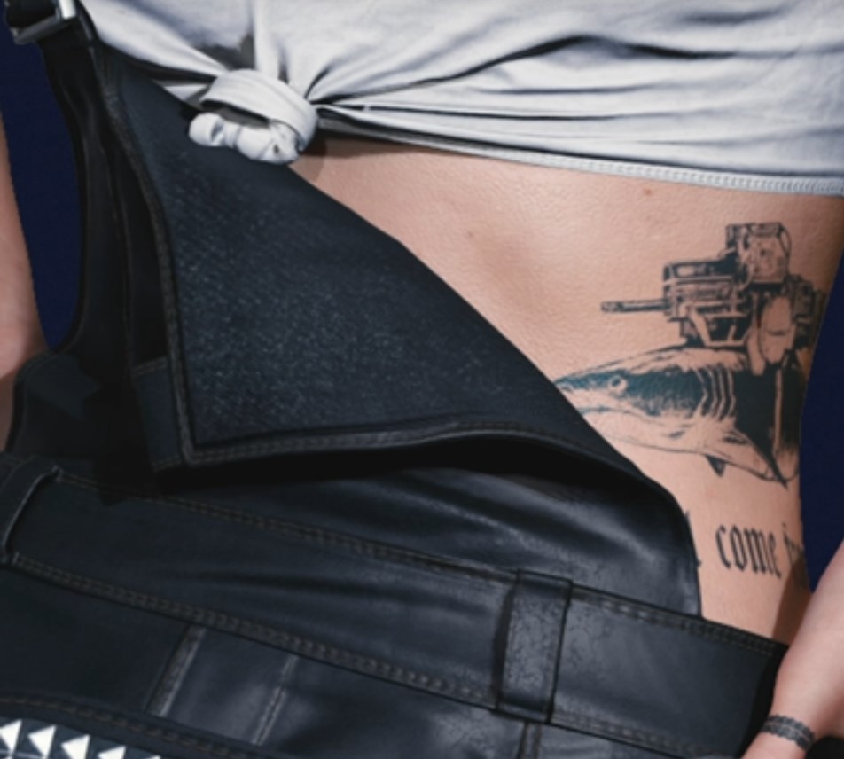 Cyberpunk 2077 Judy has a tattoo of a shark with a frickin laser beam