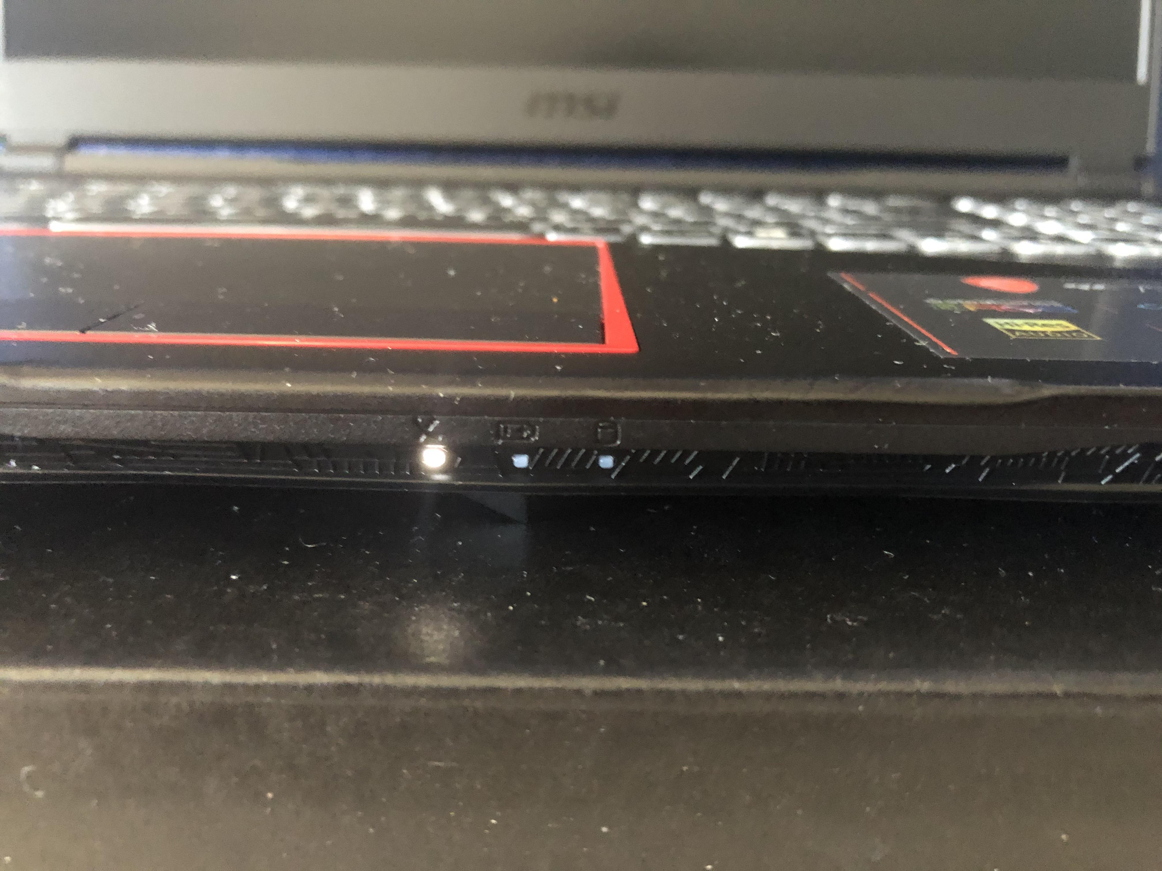 Does anyone know what these 3 white lights at the bottom of my laptop