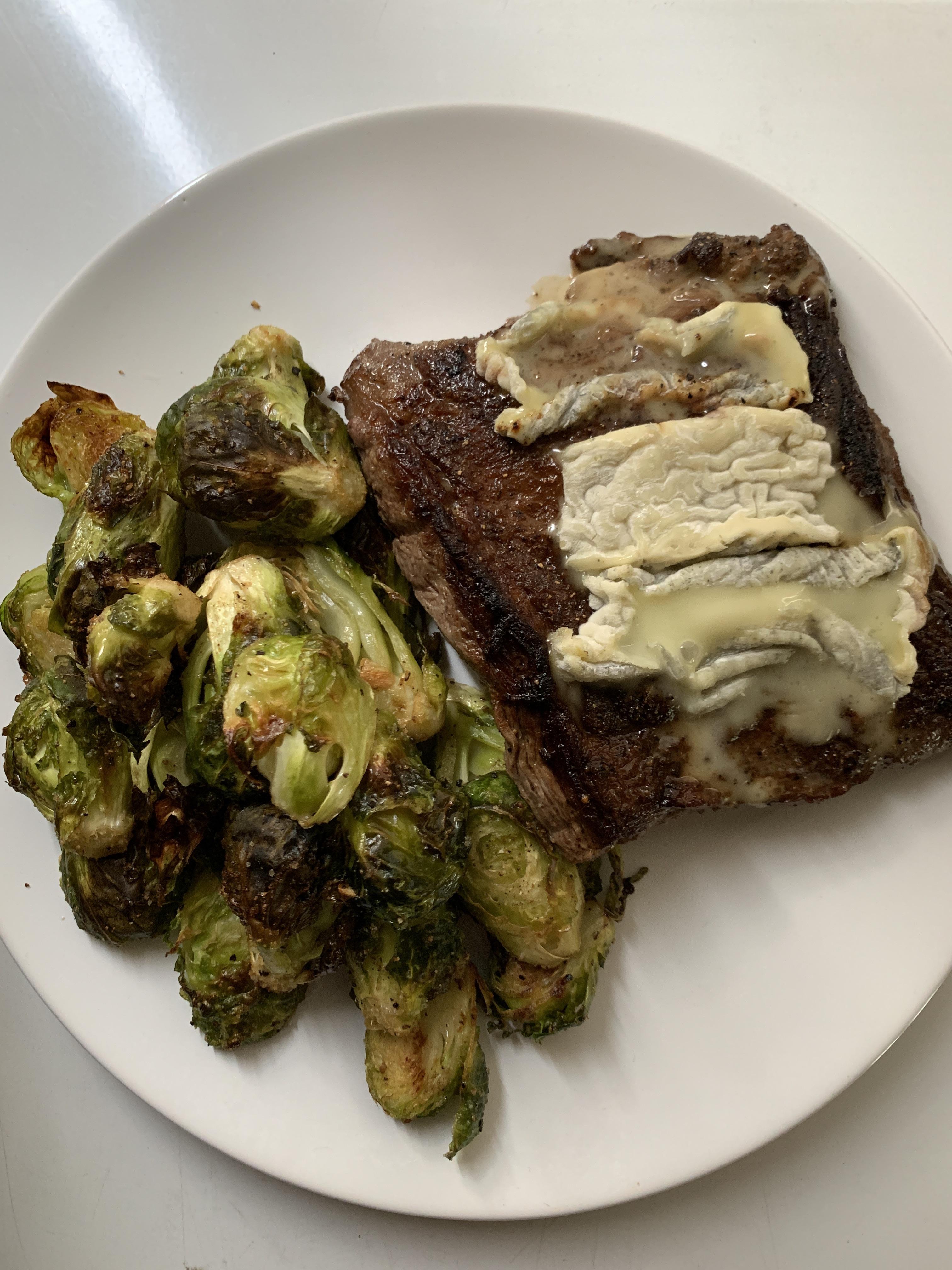 Skirt steak cooked in butter and garlic, topped with melted goat cheese