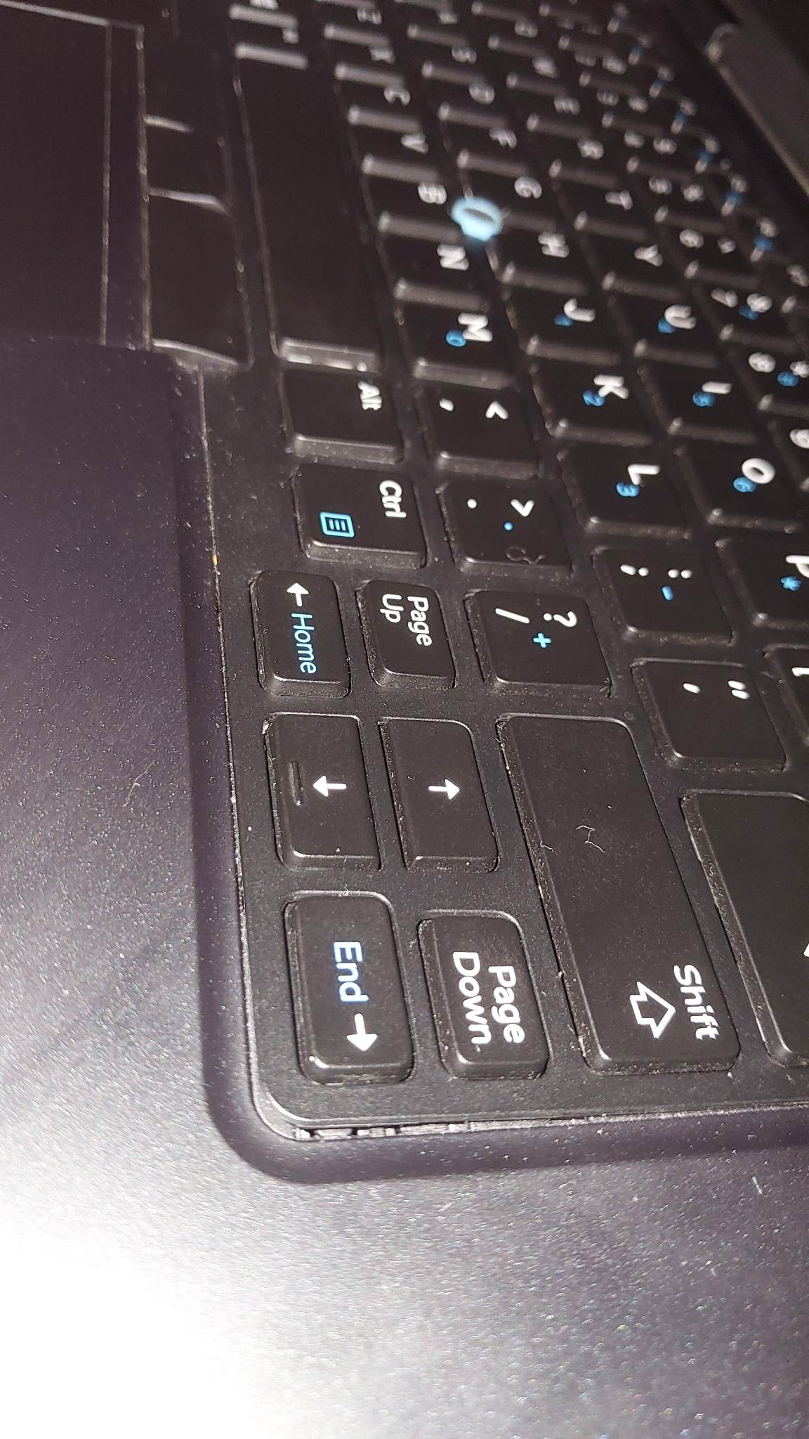 What do you do if the laptop's keyboard plastic covering is bulging out