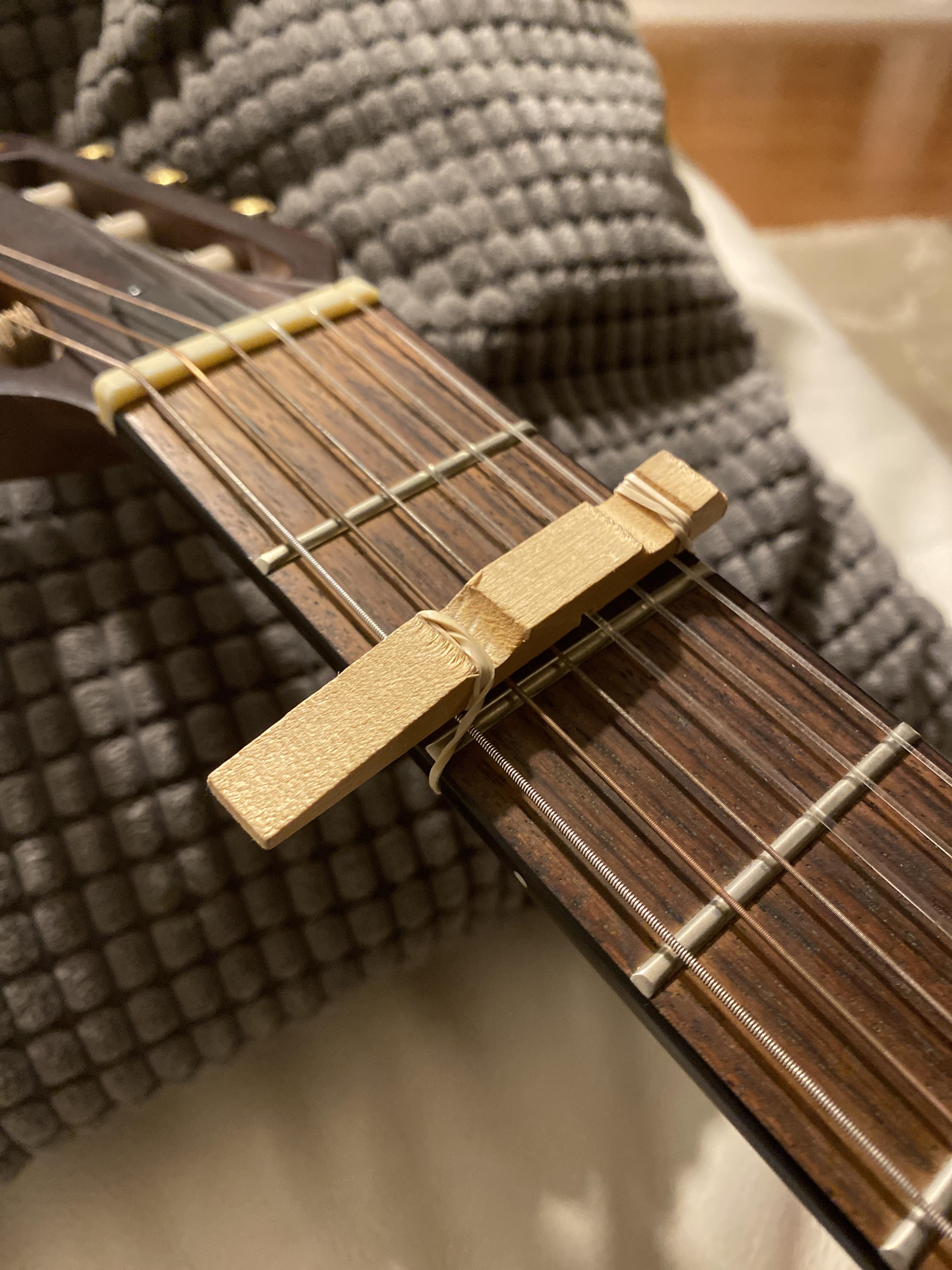 I didn’t have a capo so I used a clothespin, a rubber band, and a