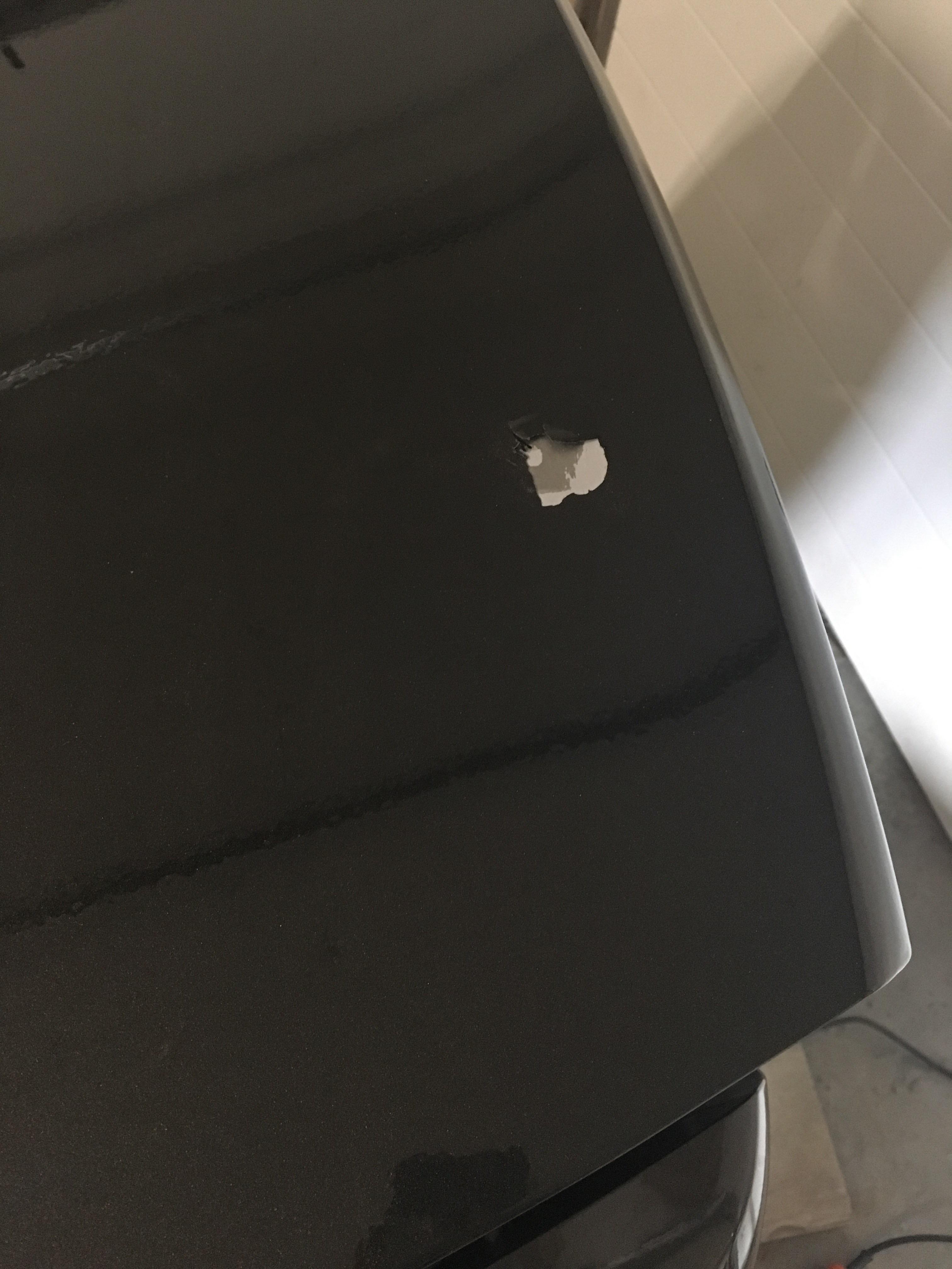 Was mounting a spoiler using double sided 3M tape instead of using the screws. After adjusting