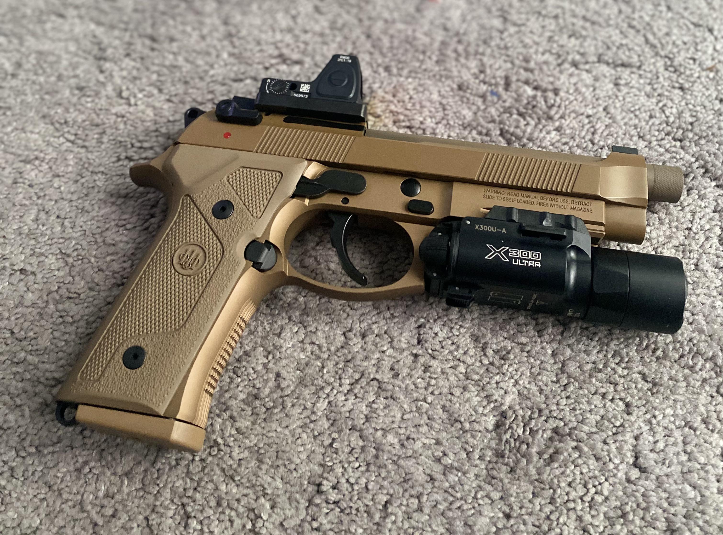 Beretta M9A4 with stainless steel guide rod, A3 grips, Surefire X300
