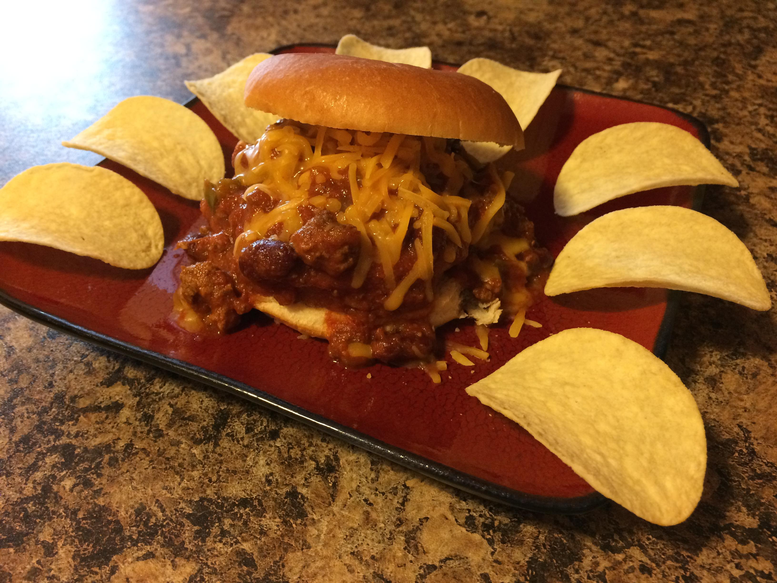 Microwaved chicken patty smothered in chili...sandwich. r/shittyfoodporn
