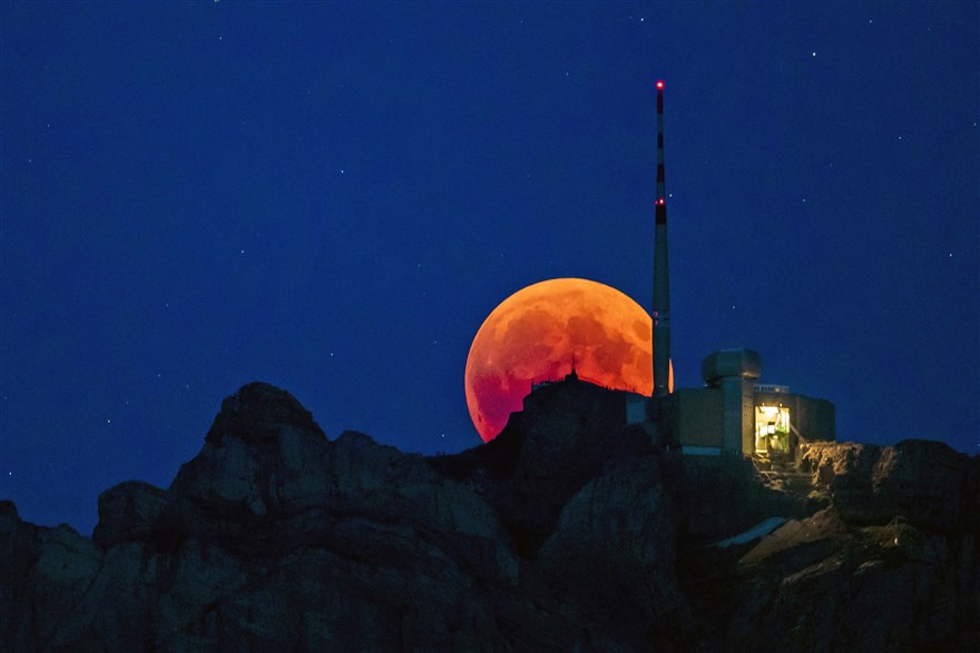 Switzerland The moon rises behind the Saentis, the highest mountain of