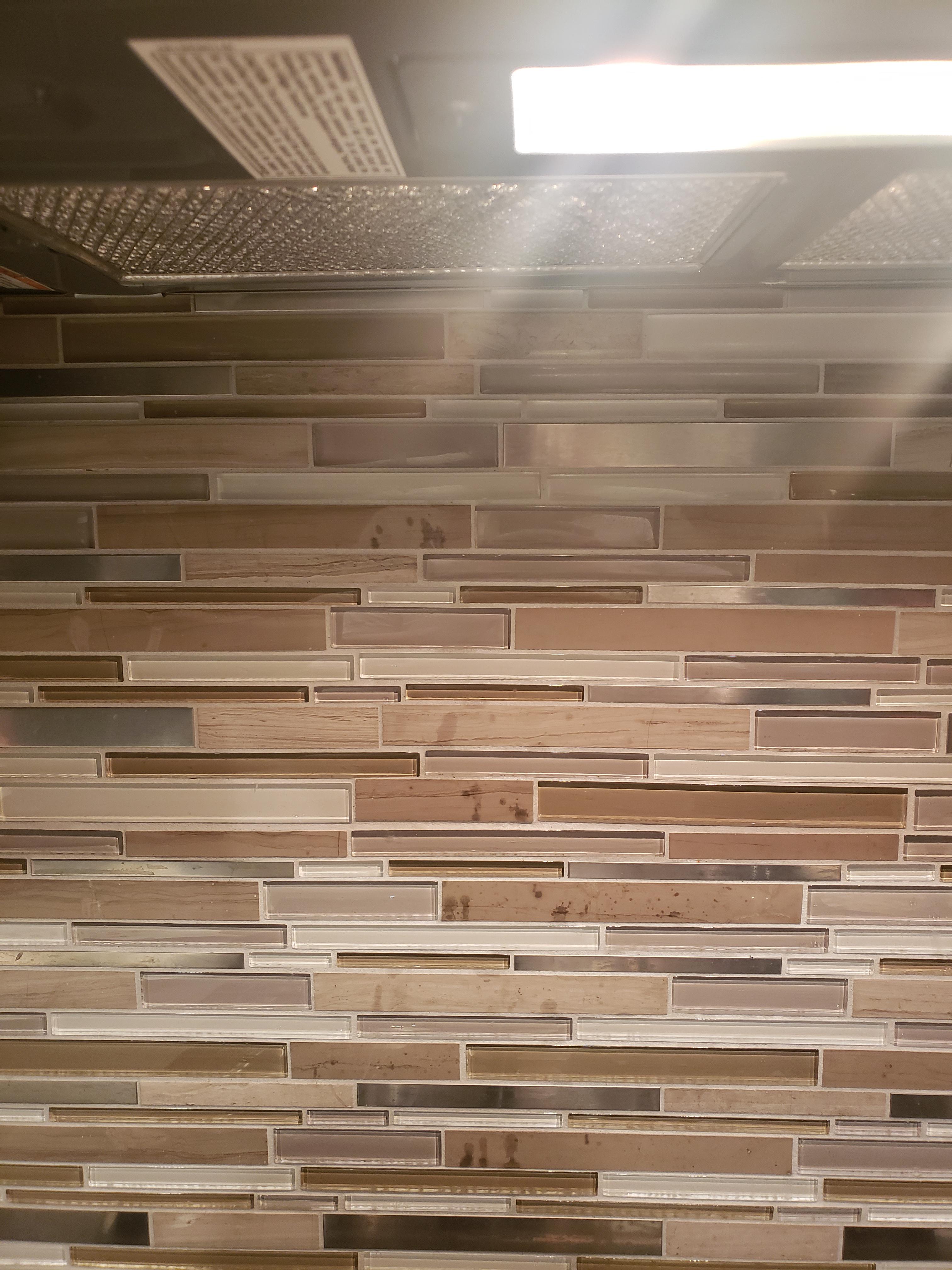 How do I fix/clean the oil stains on my backsplash? r/fixit