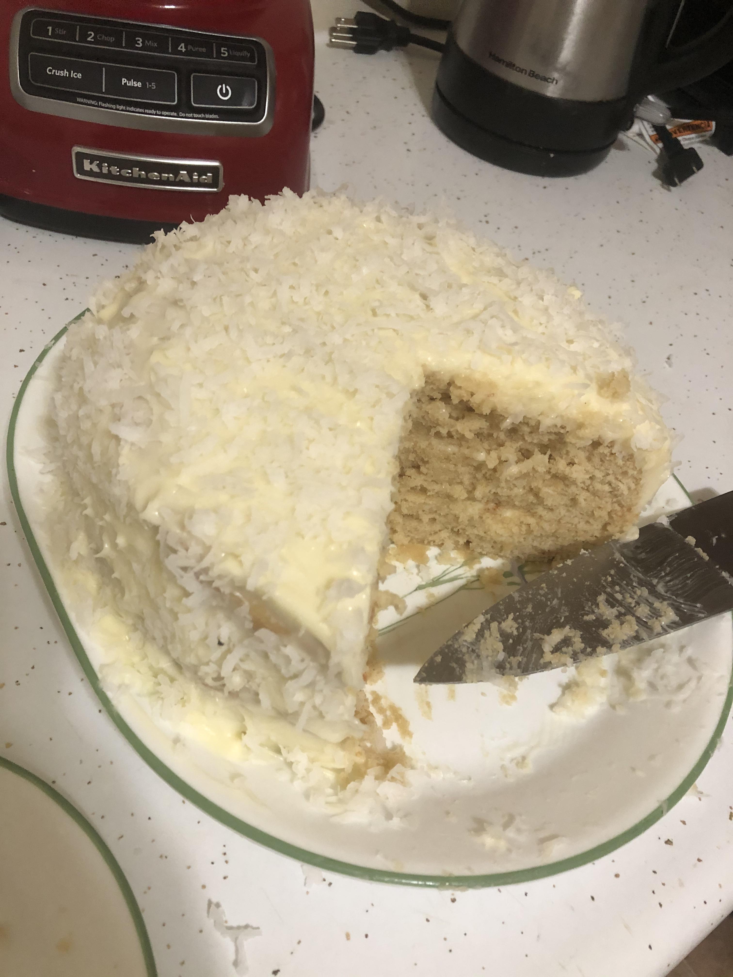 3 layer coconut cake with coconut cream cheese frosting to take