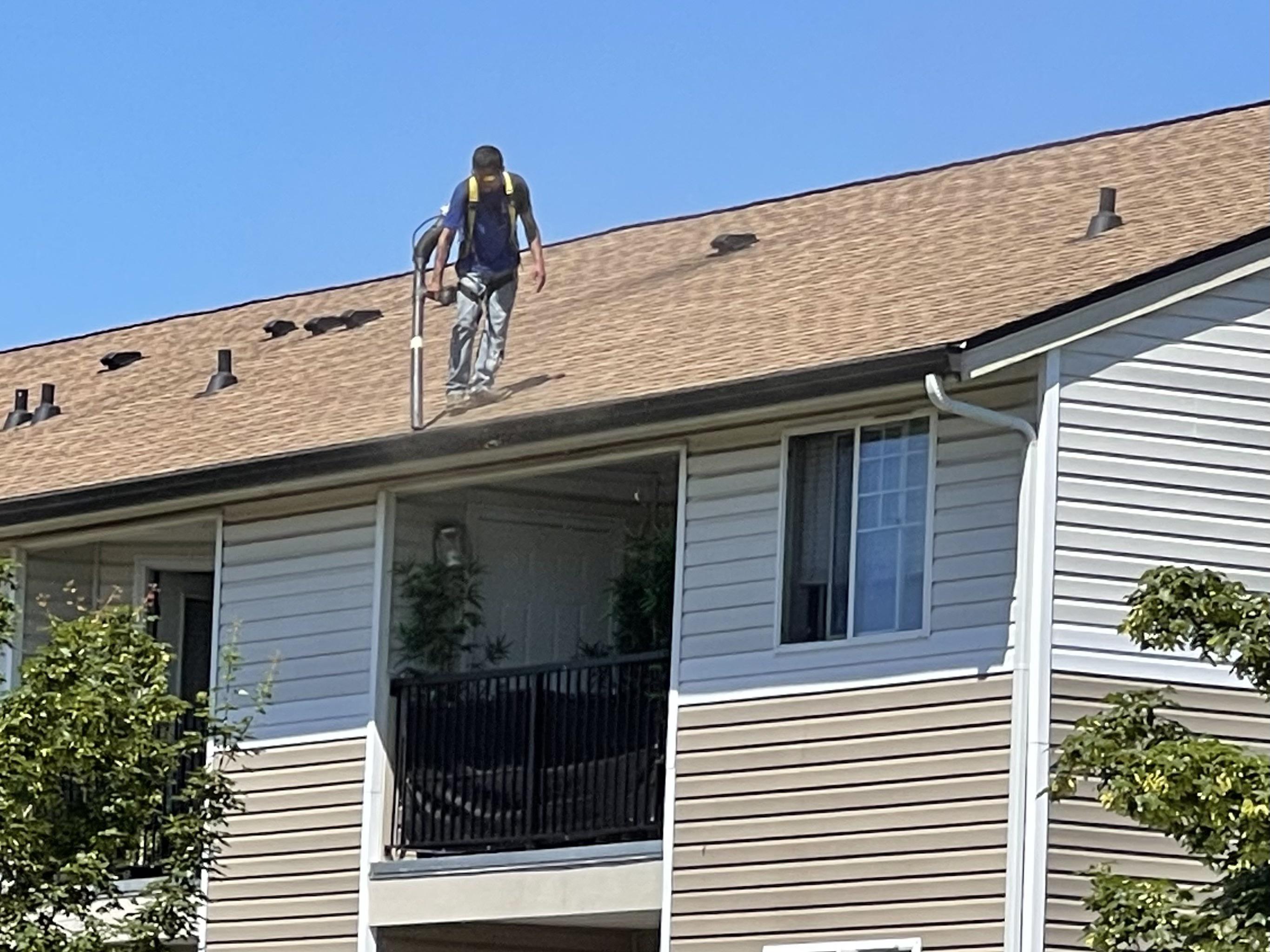 Cleaning gutters of three story apartments without a safety strap r/OSHA