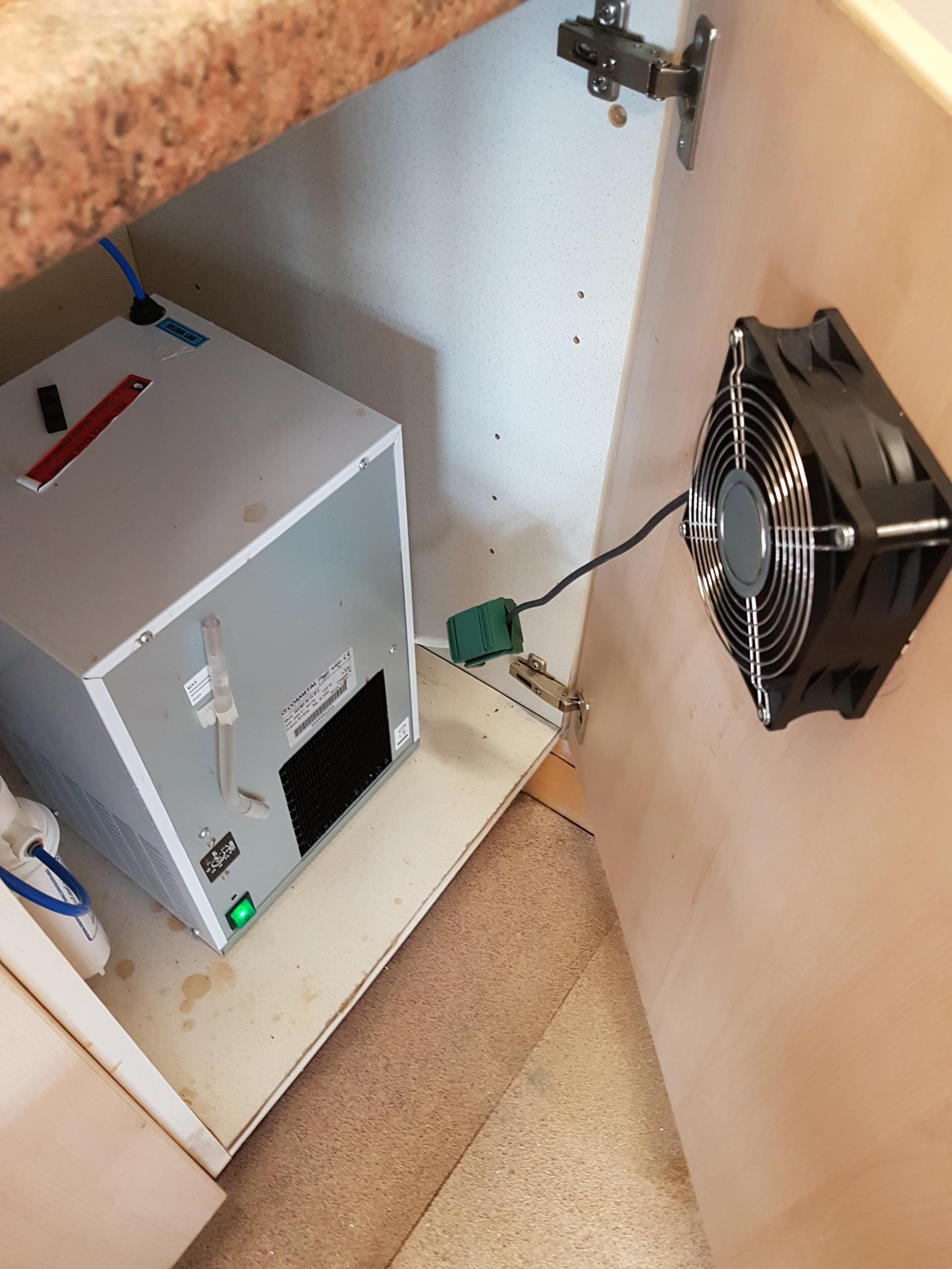 Water cooler at my workplace was overheating in the cupboard under the