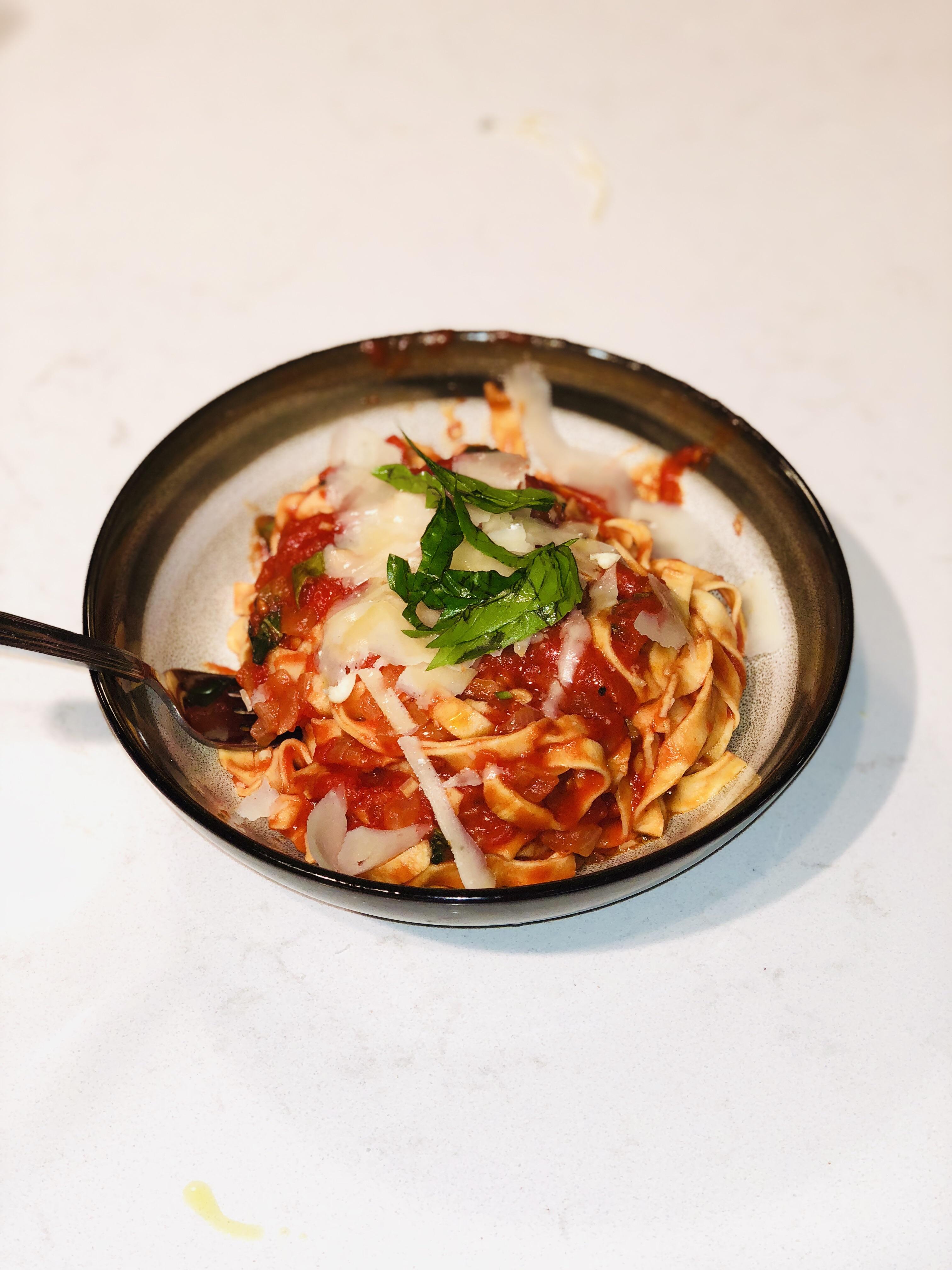 [Homemade] Fresh egg pasta with tomato basil sauce topped with Parmigiano Reggiano shavings r/food