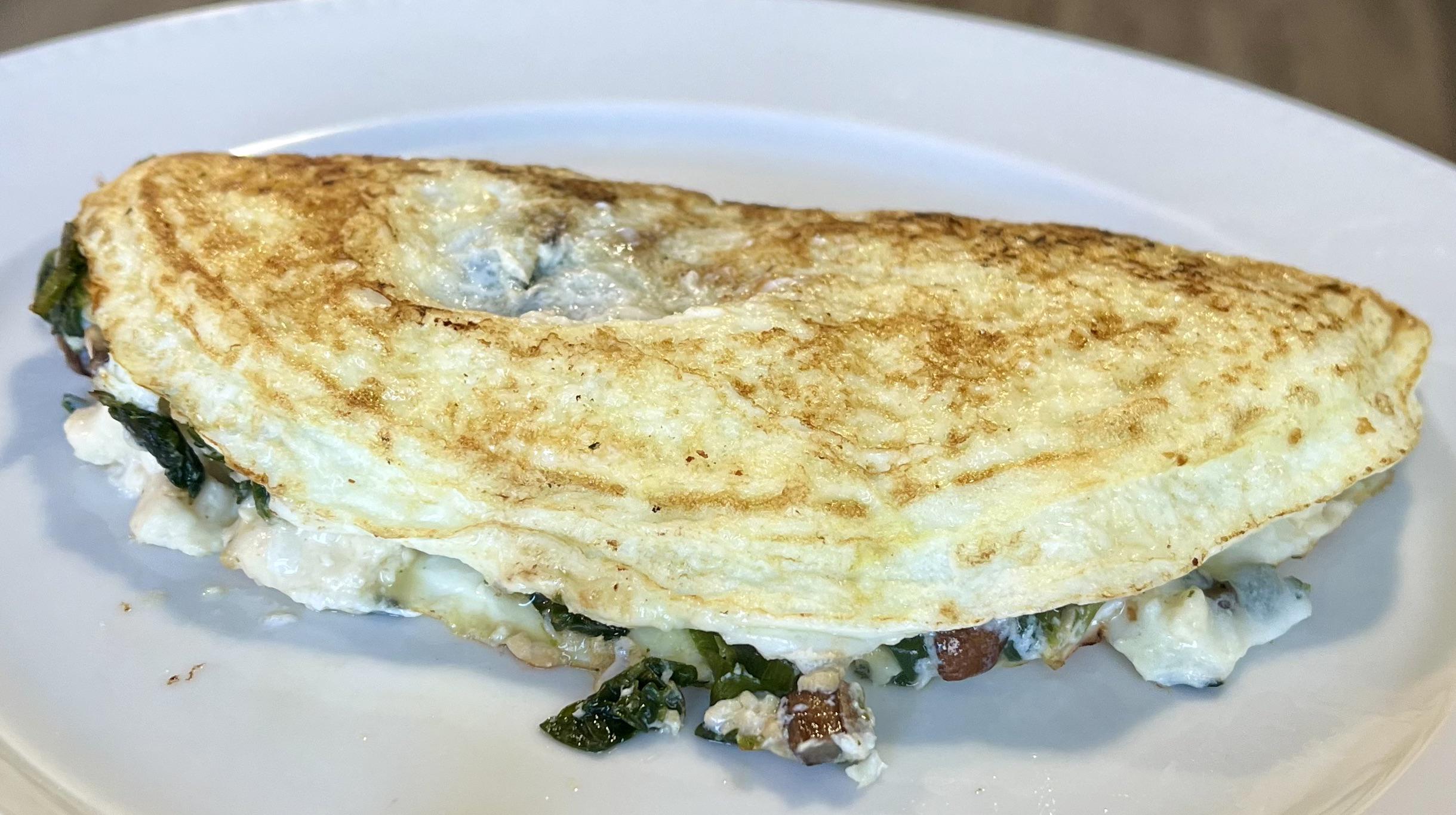 Egg white omelette with spinach, mushrooms, garlic, and garlic & herb