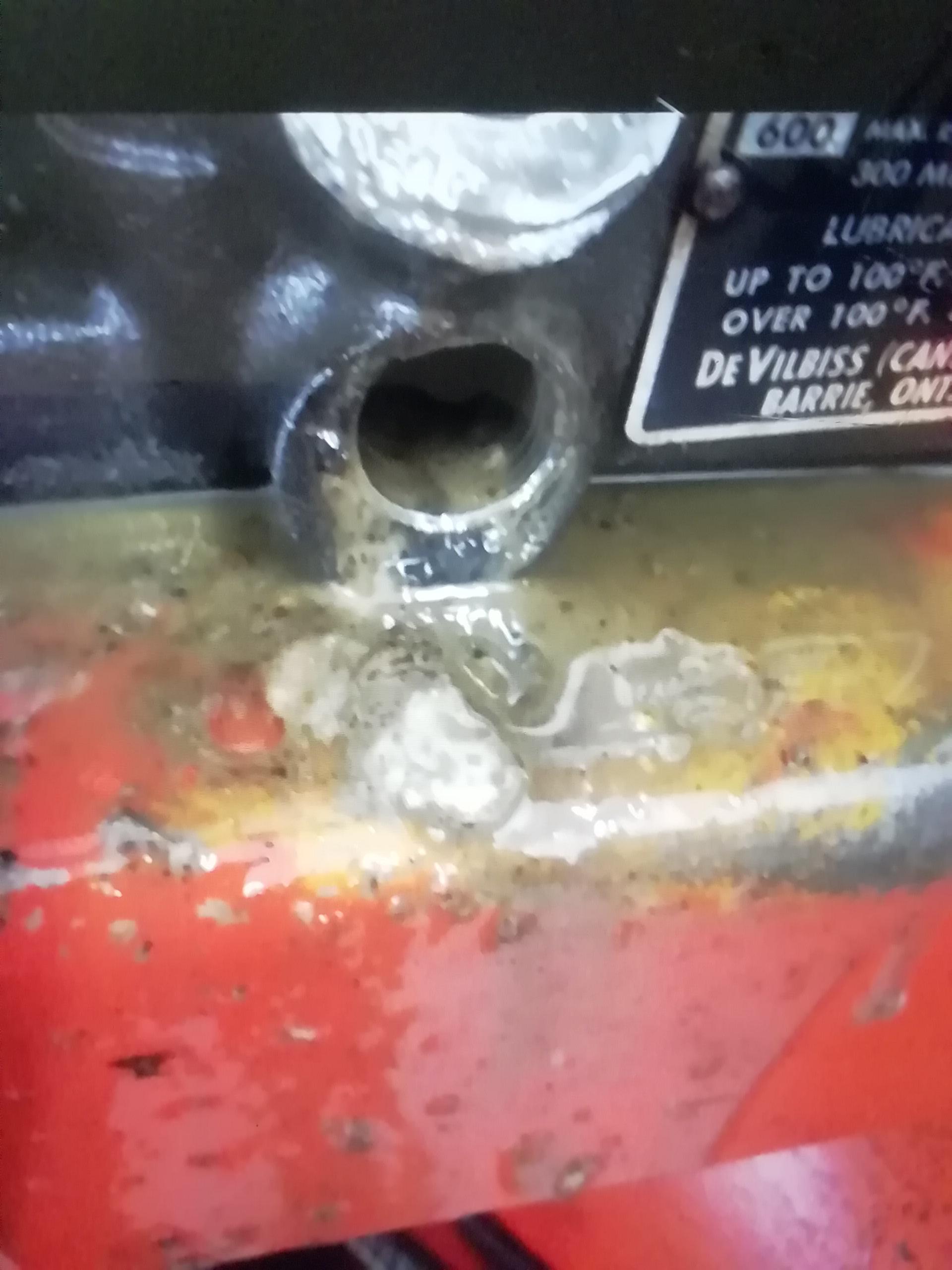 Milky crap in a DeVilBiss air compressor. I've done lots of services on
