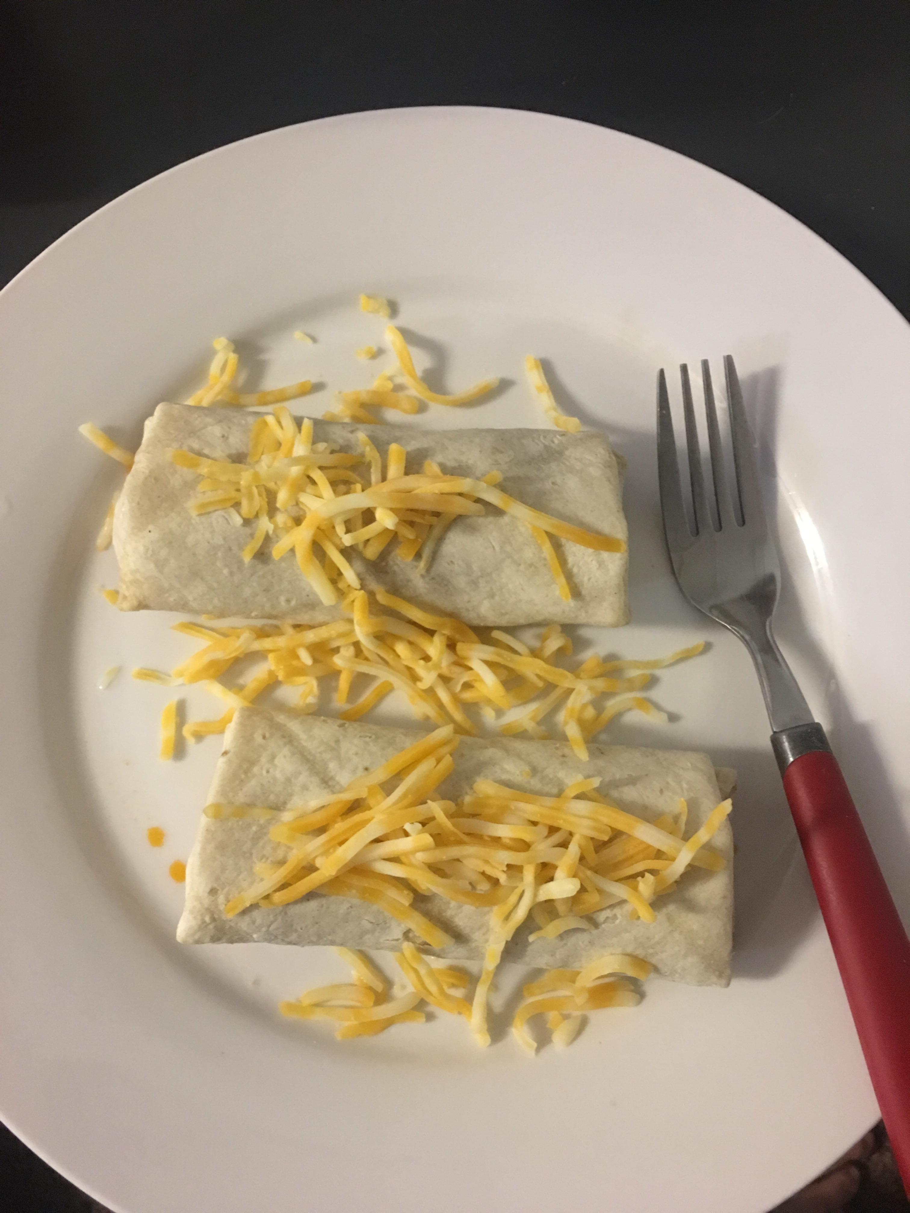 My dinner tonight, 2 frozen burritos topped with cheese r/shittyfoodporn