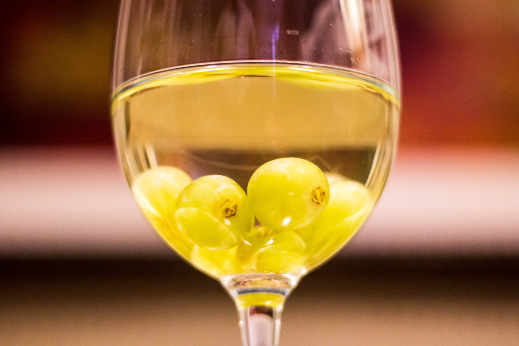 Keep some white grapes in the freezer. You can use them as ice cubes in