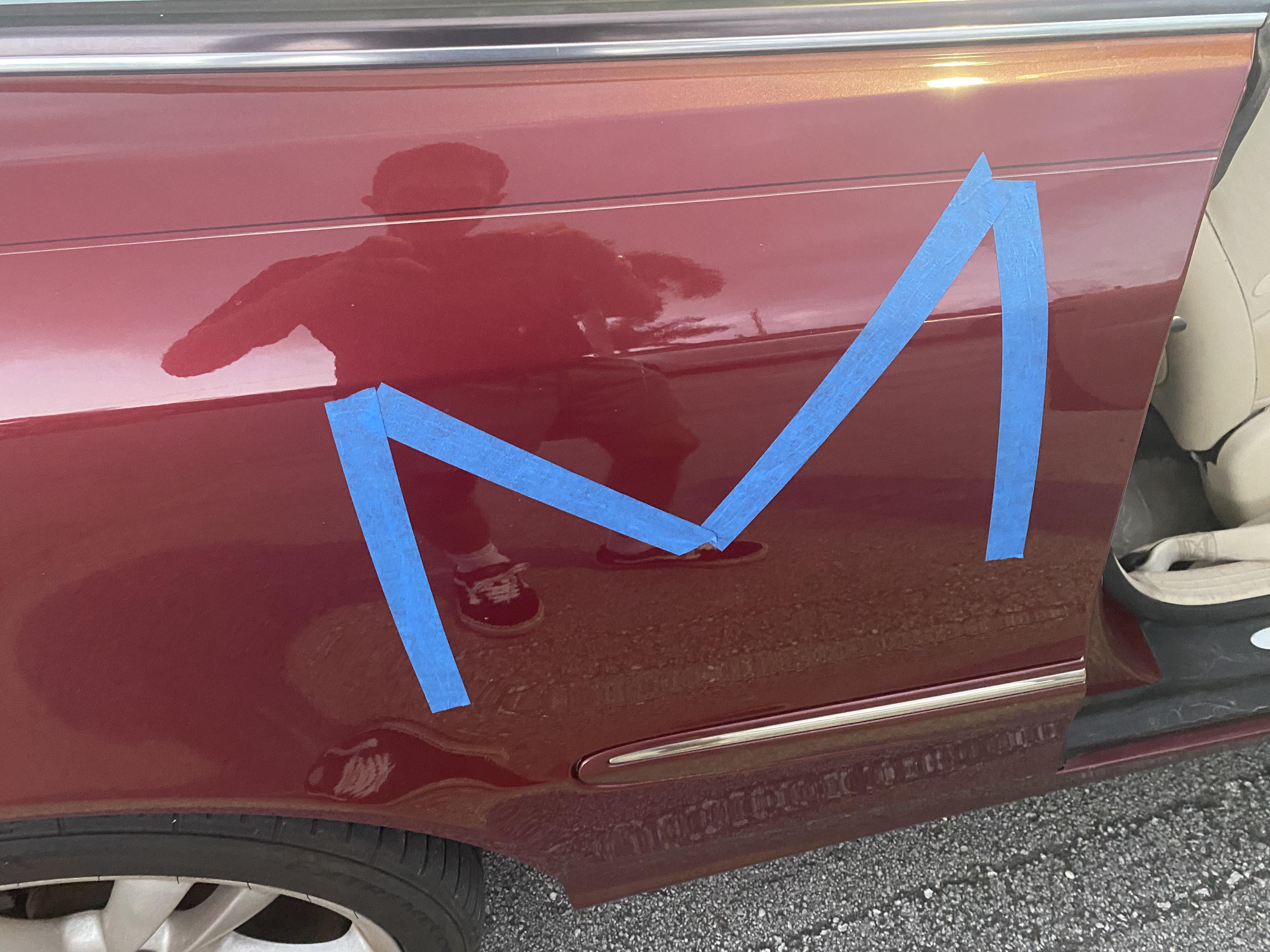 How do I take this masking tape off my benz?Car is 10+ years old with