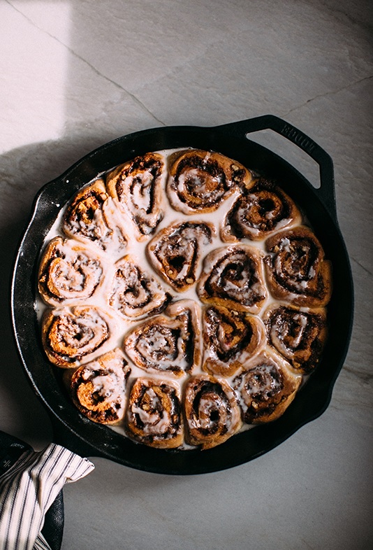 Huckberry BourbonVanilla Iced Cast Iron Cinnamon Rolls (Recipe in