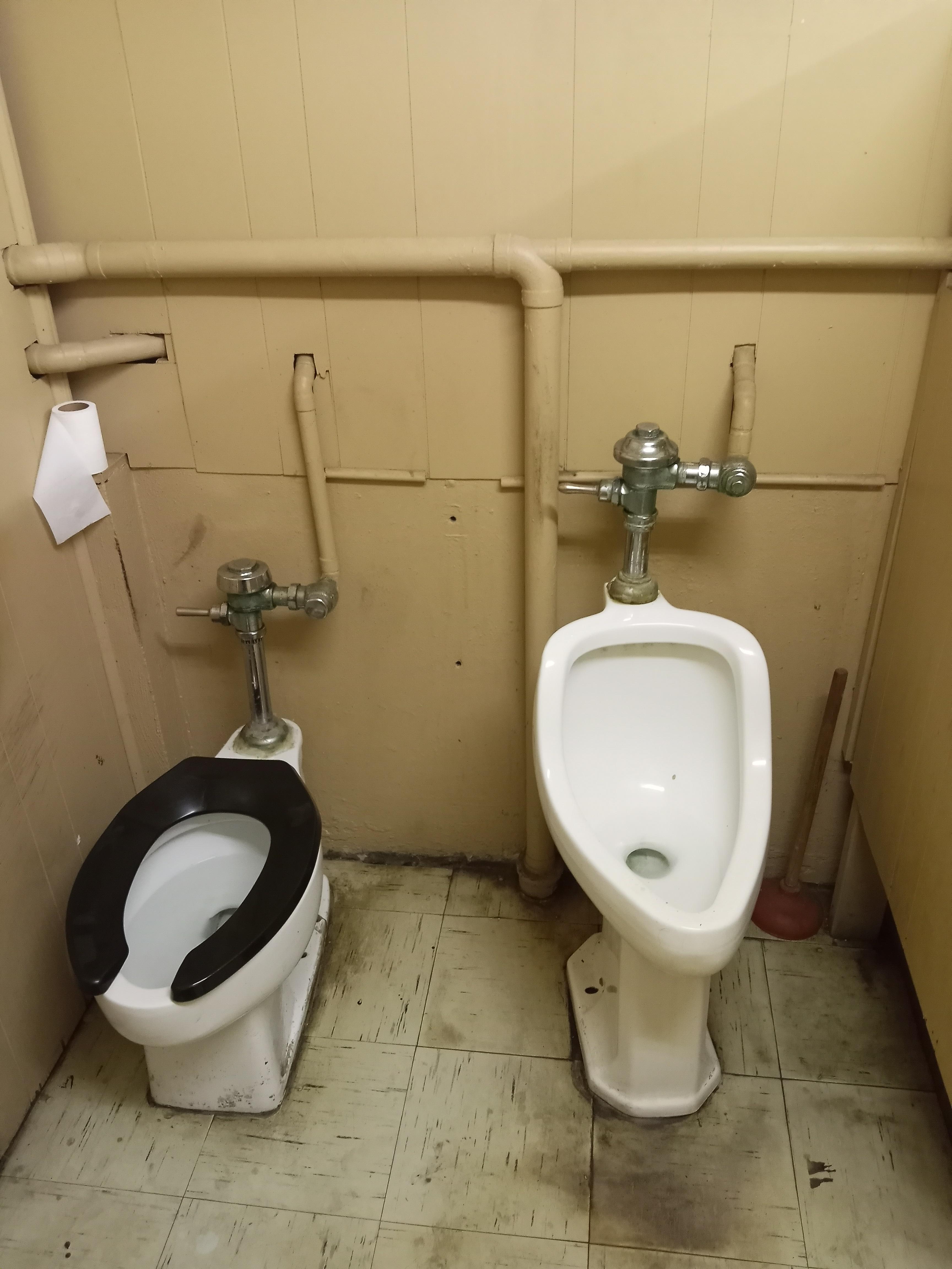 Freestanding urinal in a funky old bathroom. r/mildlyinteresting