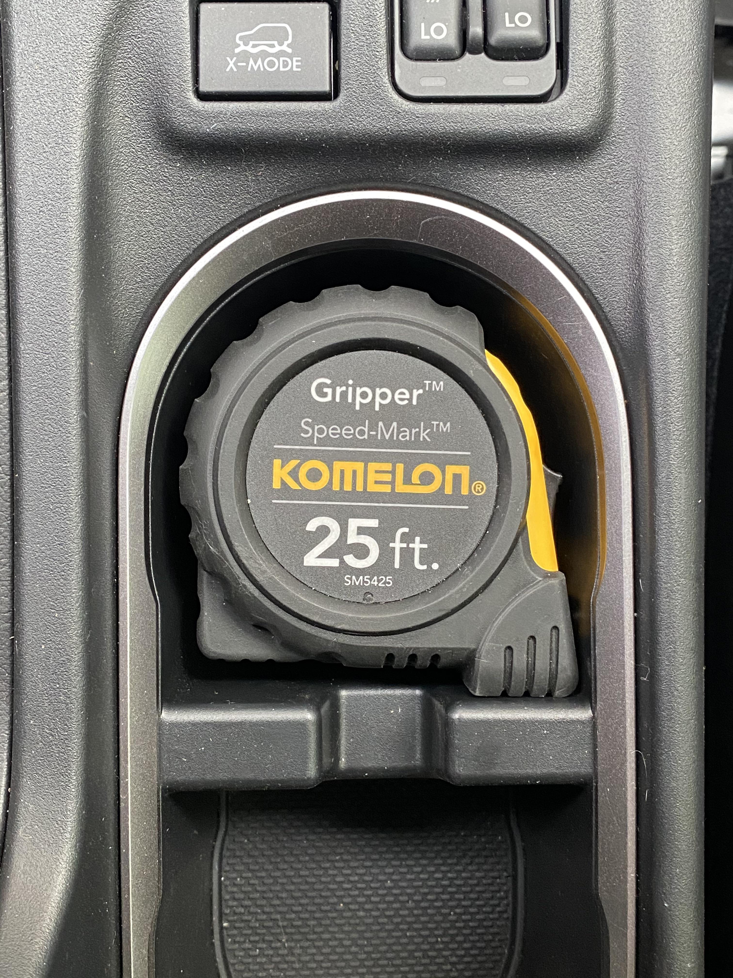 Tape measure in my 2021 Subaru Crosstrek cup holder. Snug as fug r