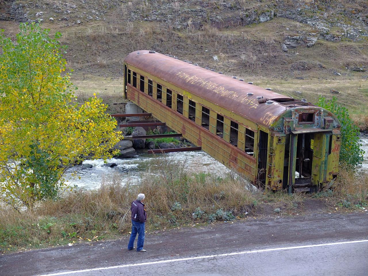 Bridge made from an old rail car over a river in the South