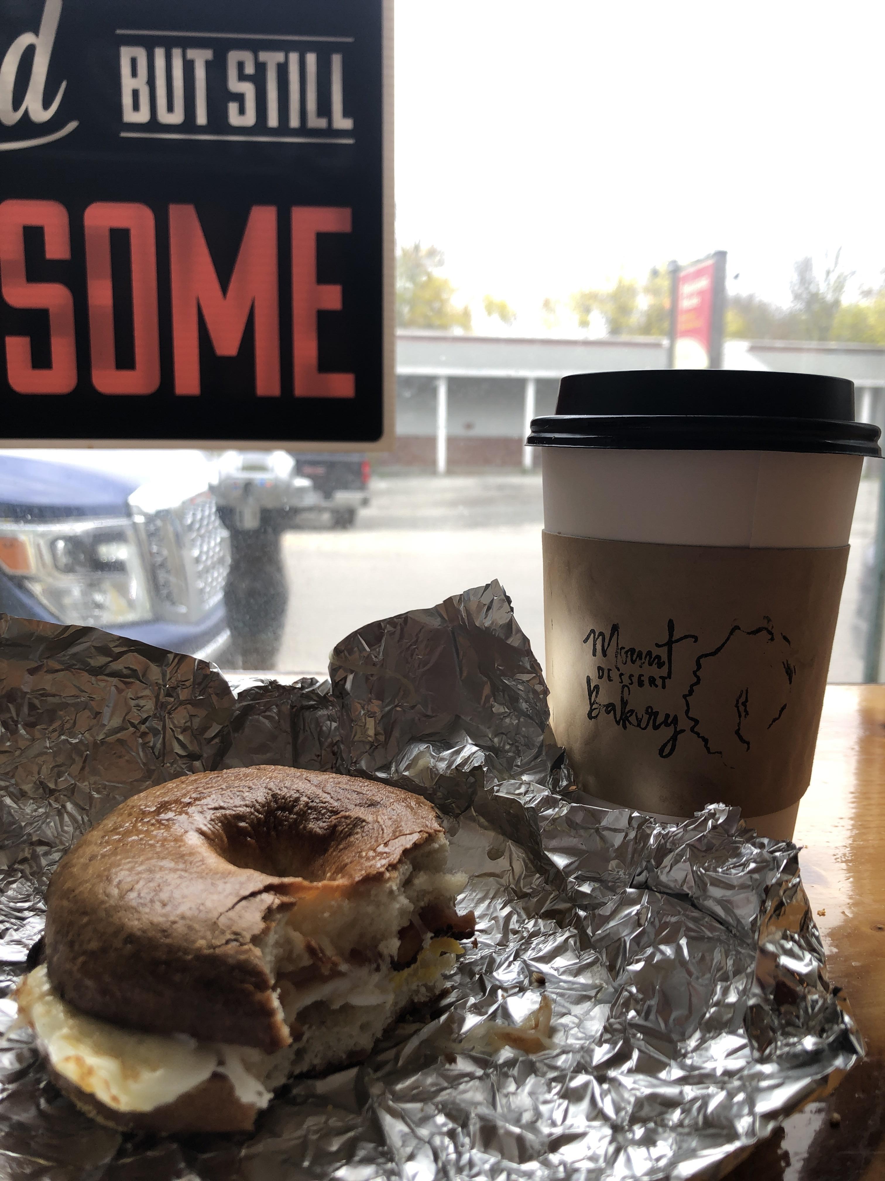 Tampa visitor enjoying a BEC bagel and Hot Chocolate at Mount Dessert