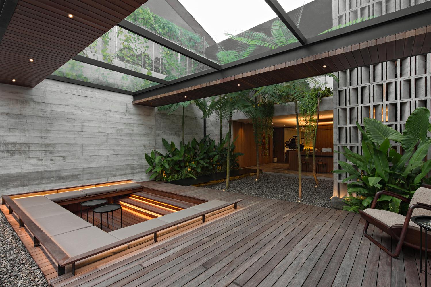 Courtyard Cwith covered sunken seating with glass ceiling Jakarta