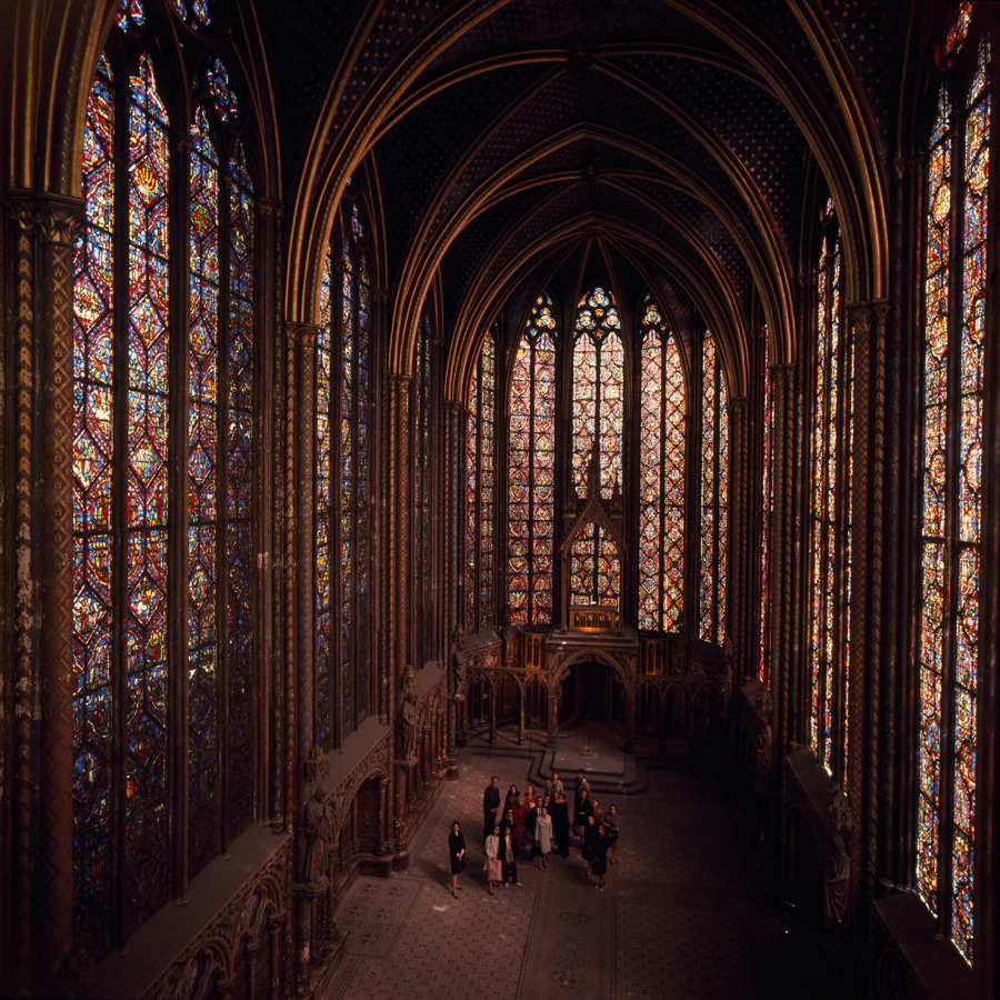 Visitors stare in awe at the stained glass windows of Sainte Chapelle