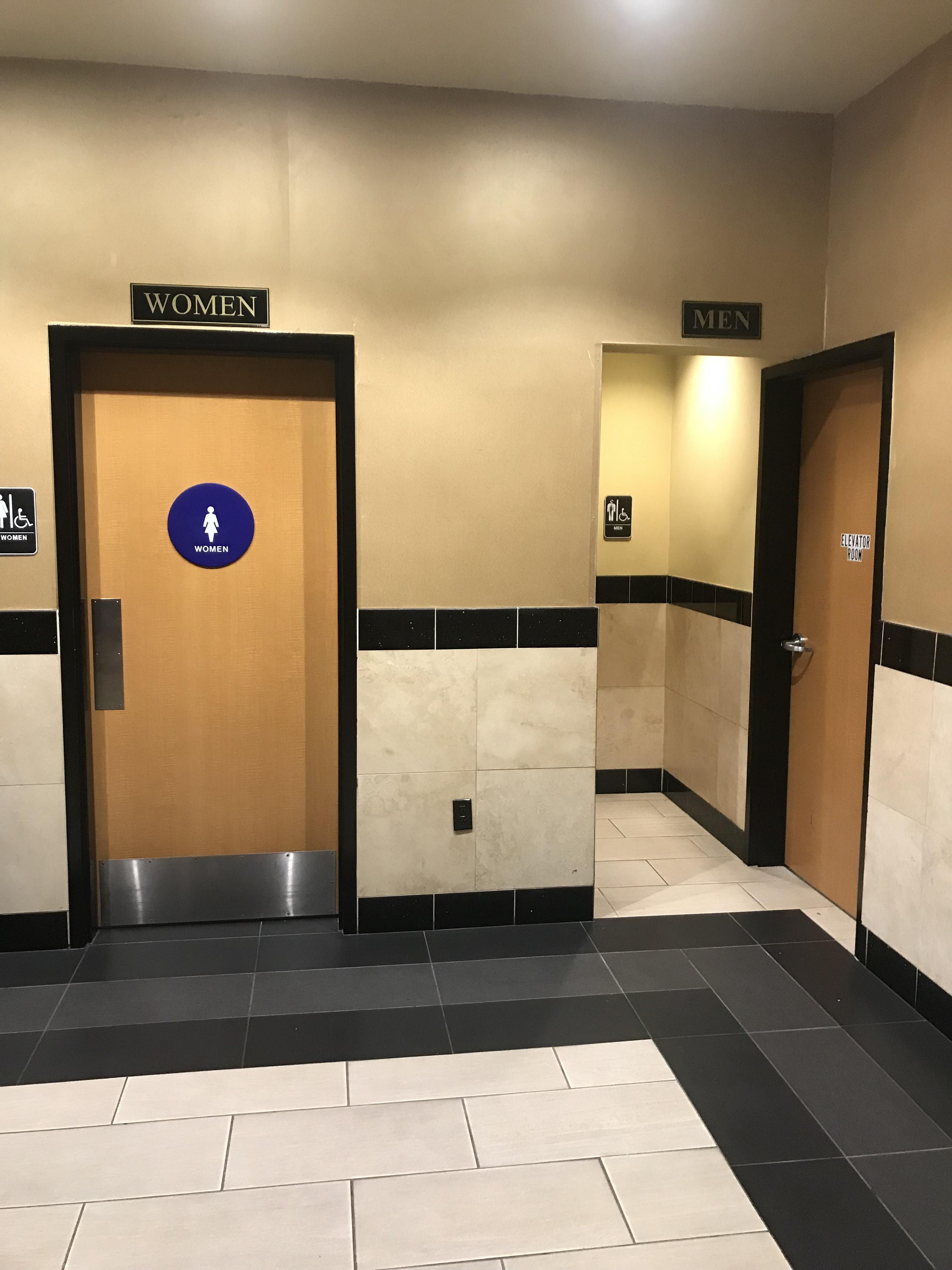The entrance to the men’s bathroom at my local movie theater. r
